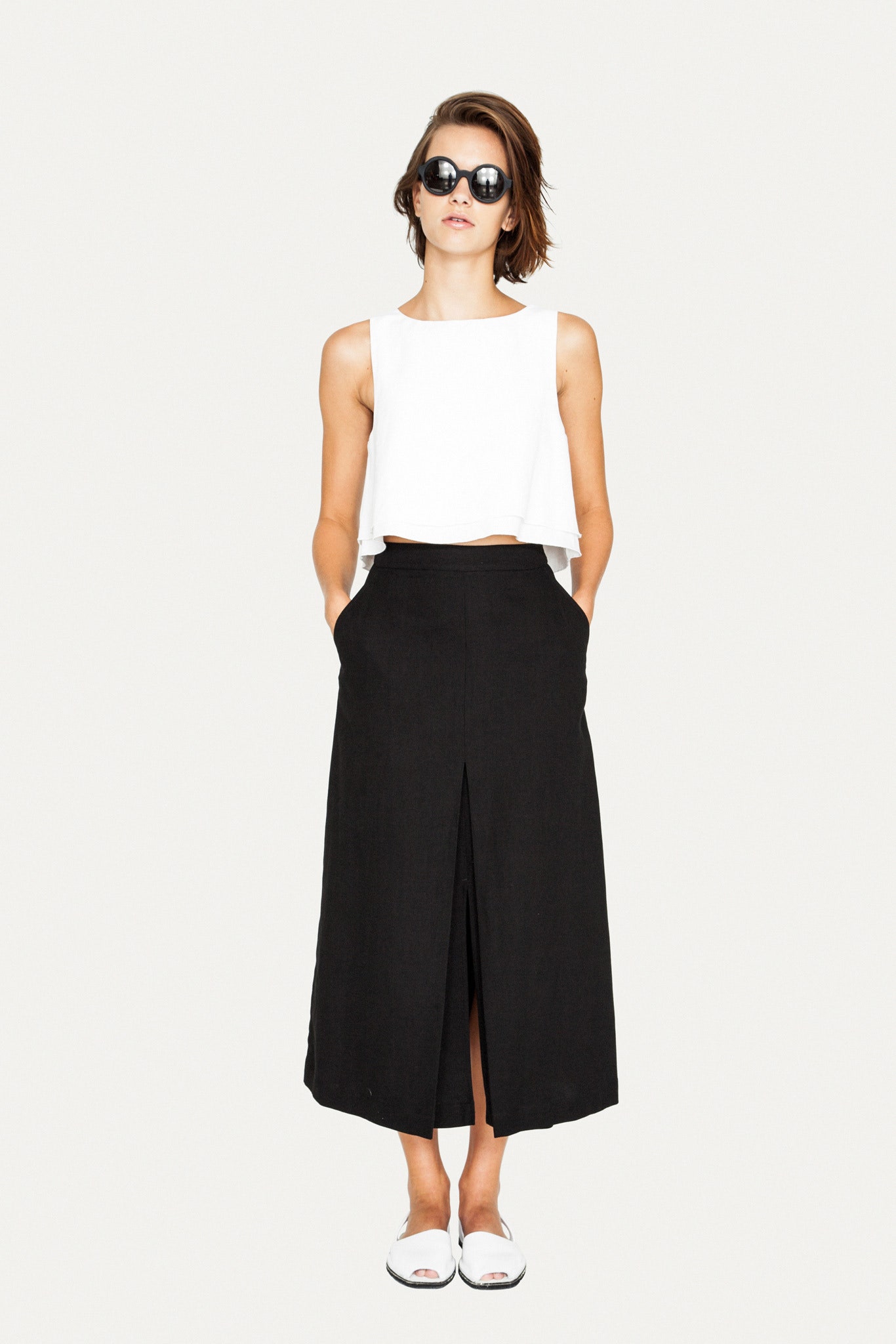 white cropped top black midi skirt