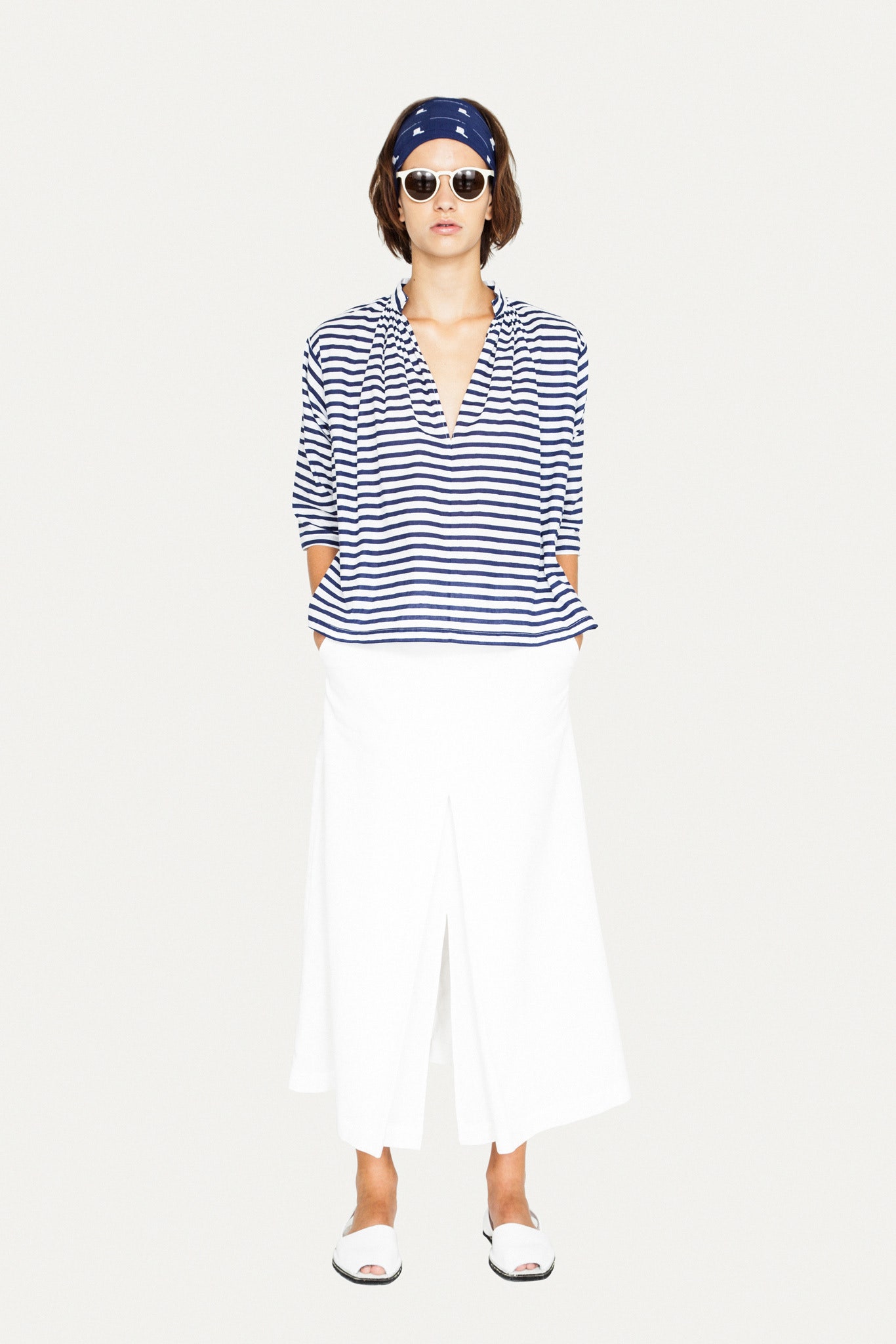 blue and white striped top with white skirt