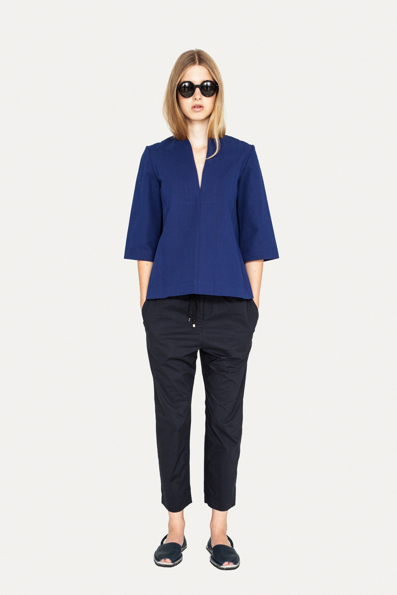 blue relaxed top with black pants