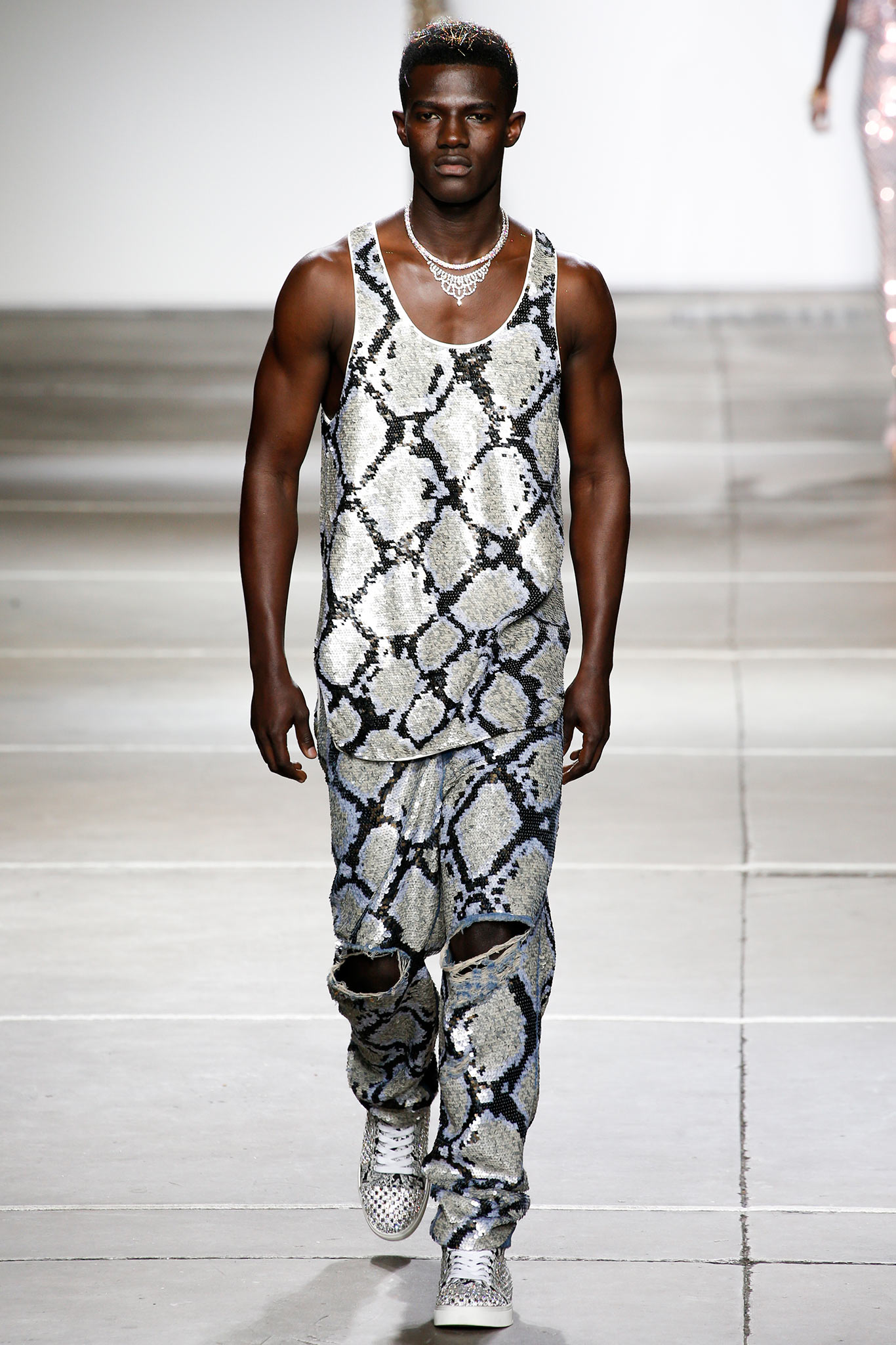 silver sequin tank-top and distressed pants