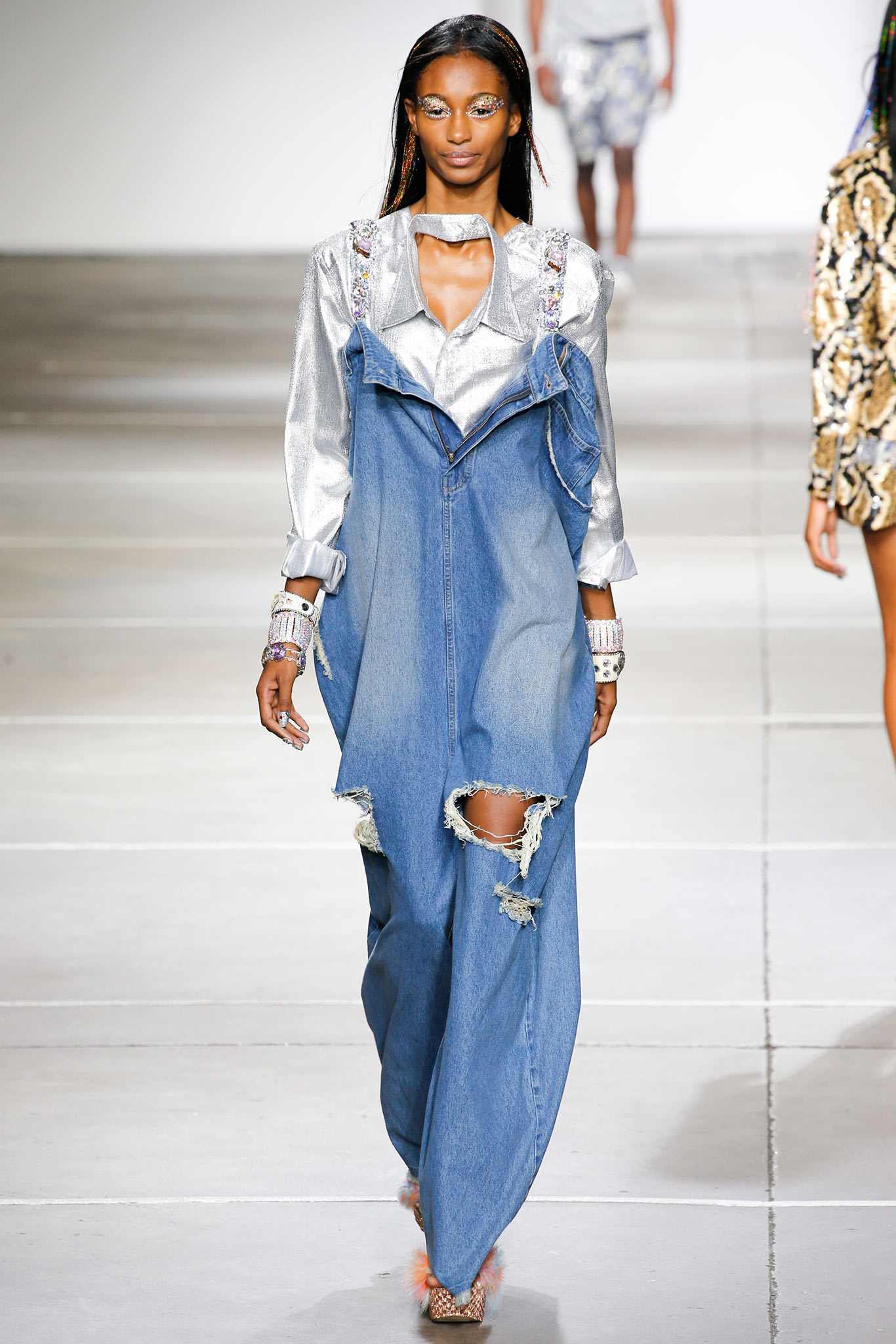 distressed denim jumpsuit with silver blouse