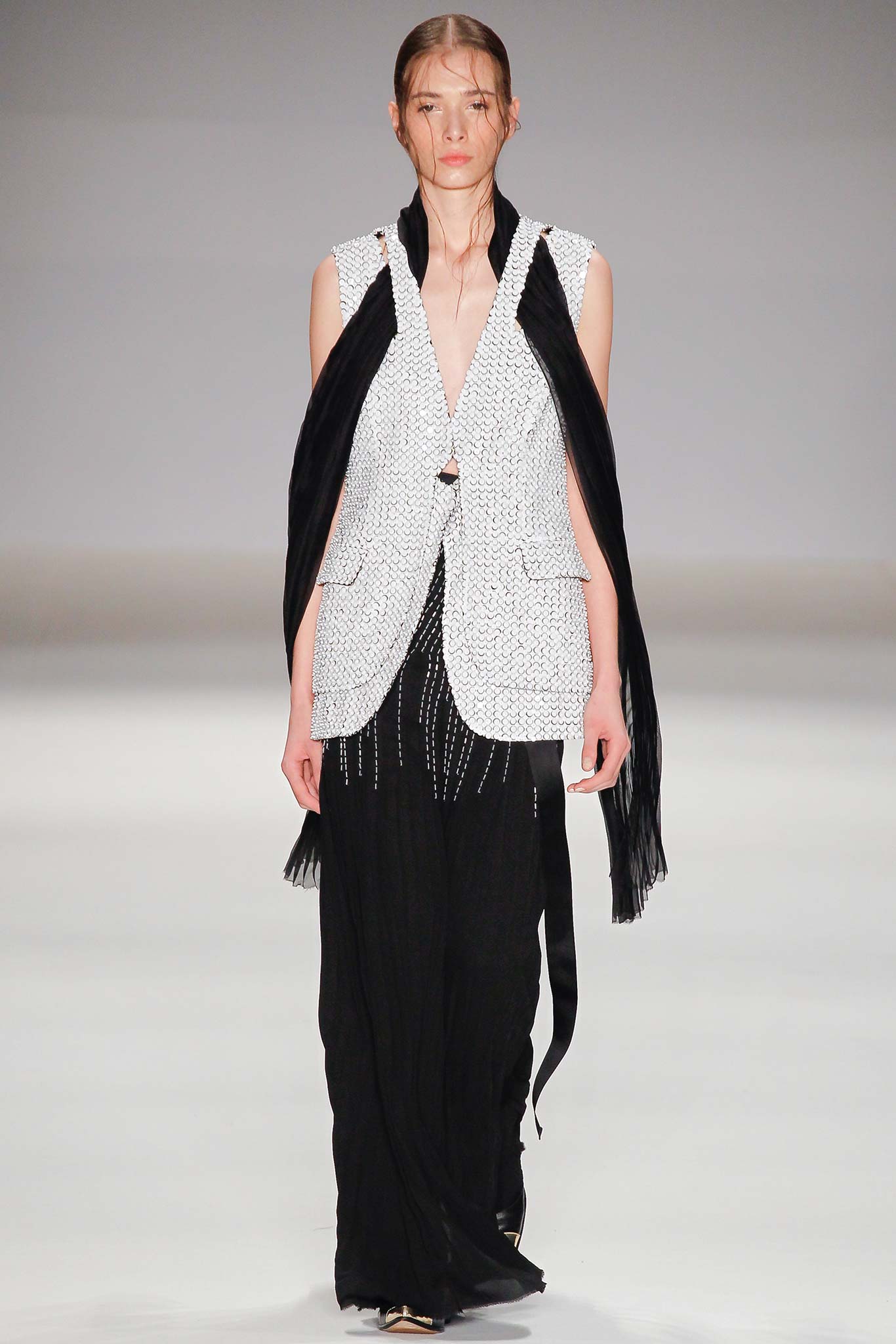 white silk sleeveless blouse and black midi skirt
