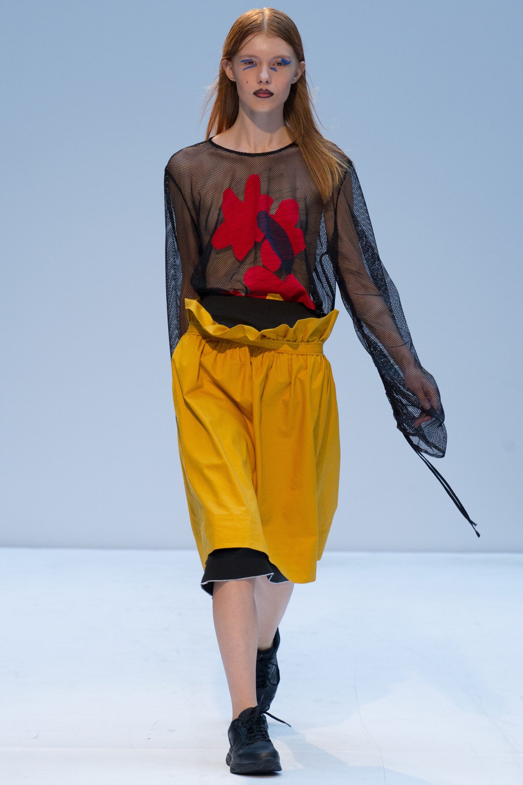 black mesh top yellow skirt