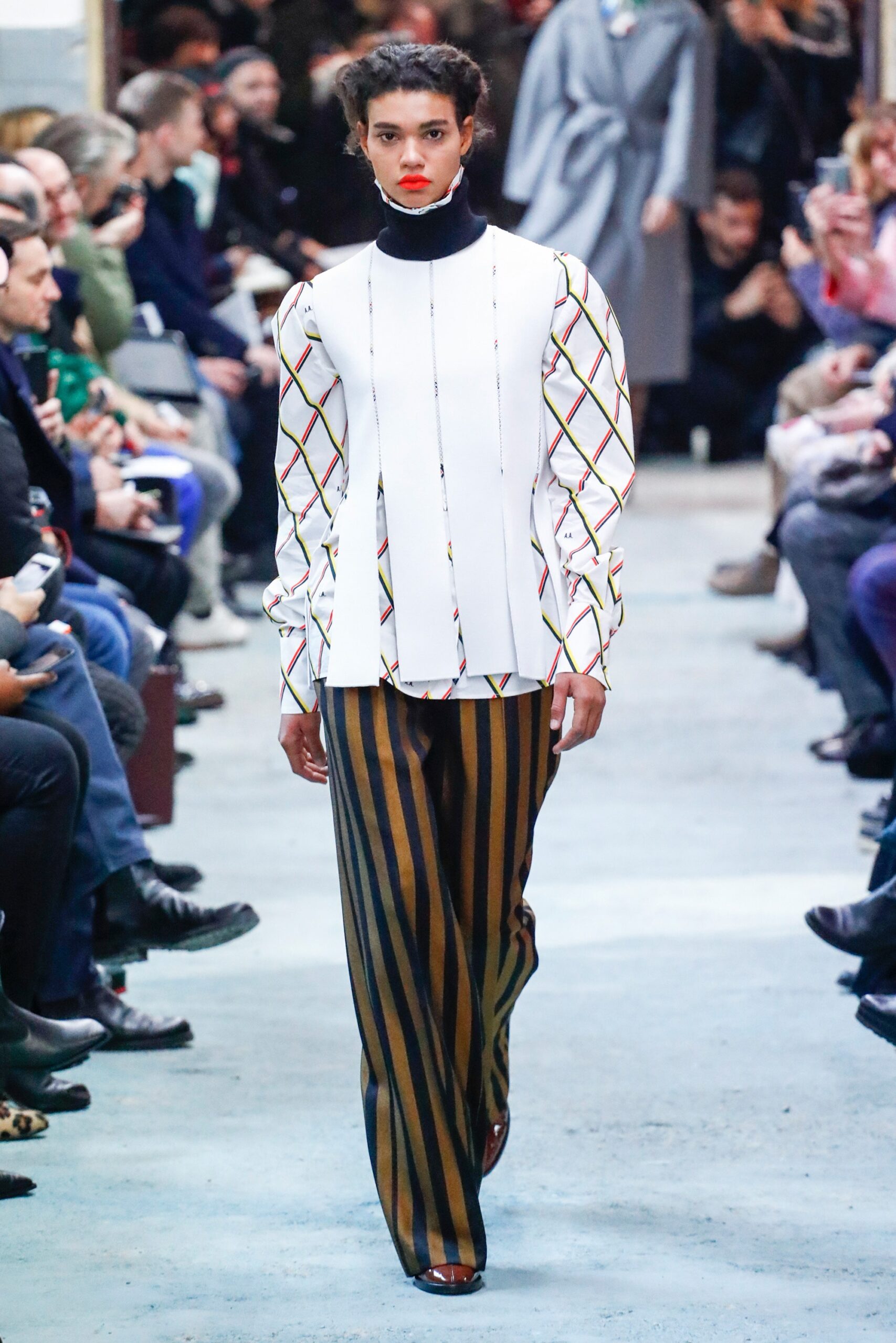 fitted white top with striped pants