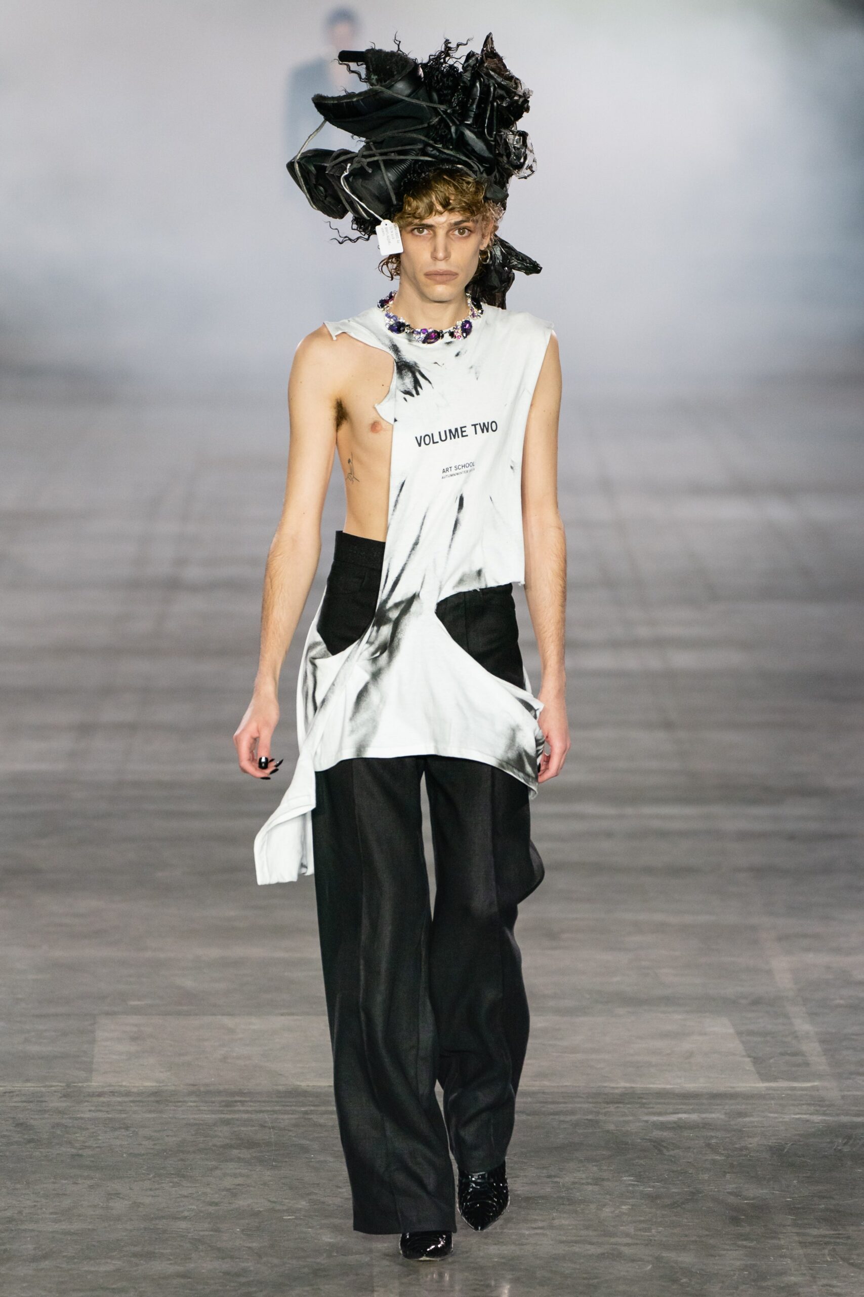 relaxed white top and tailored black pants