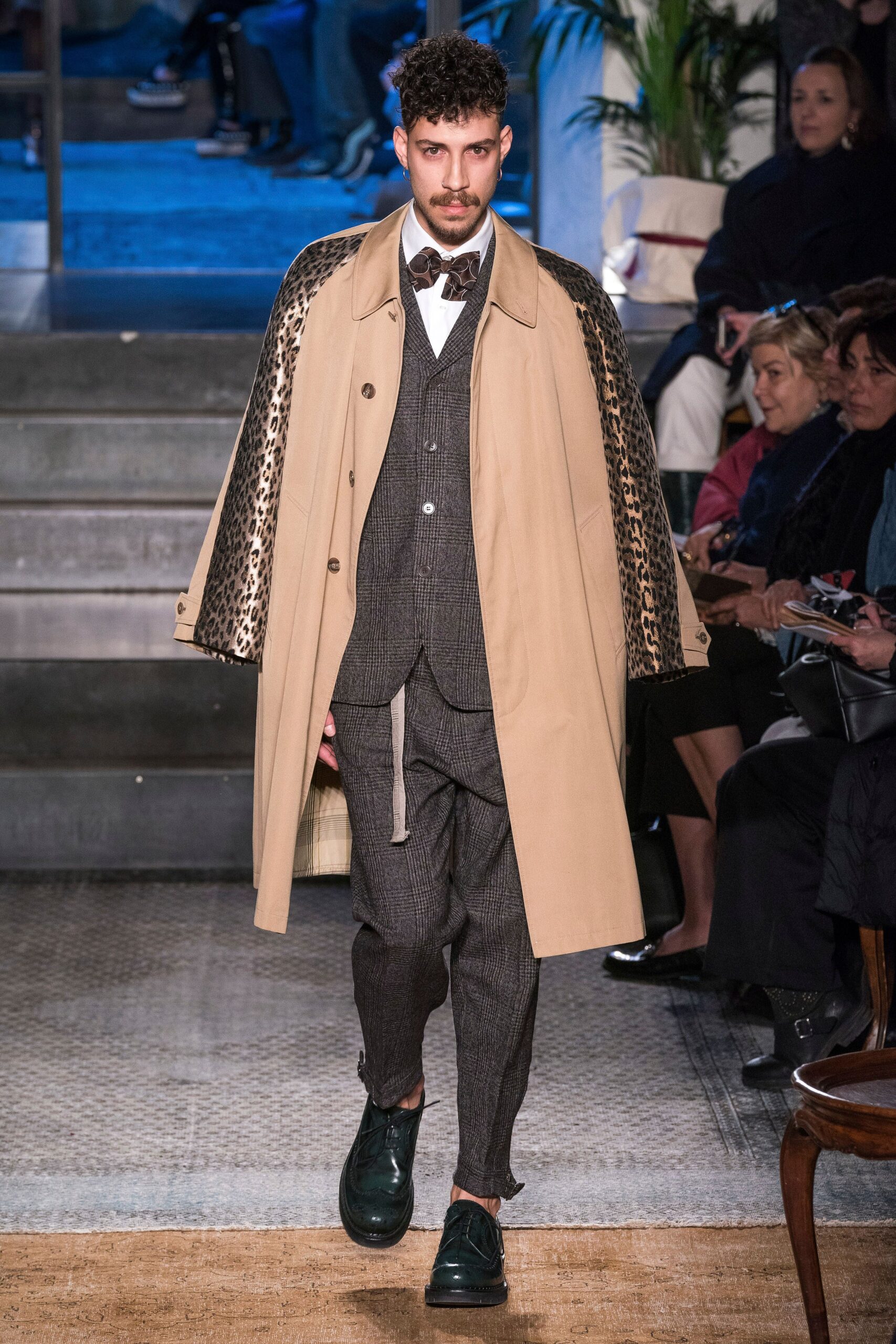 beige coat gray suit black pants