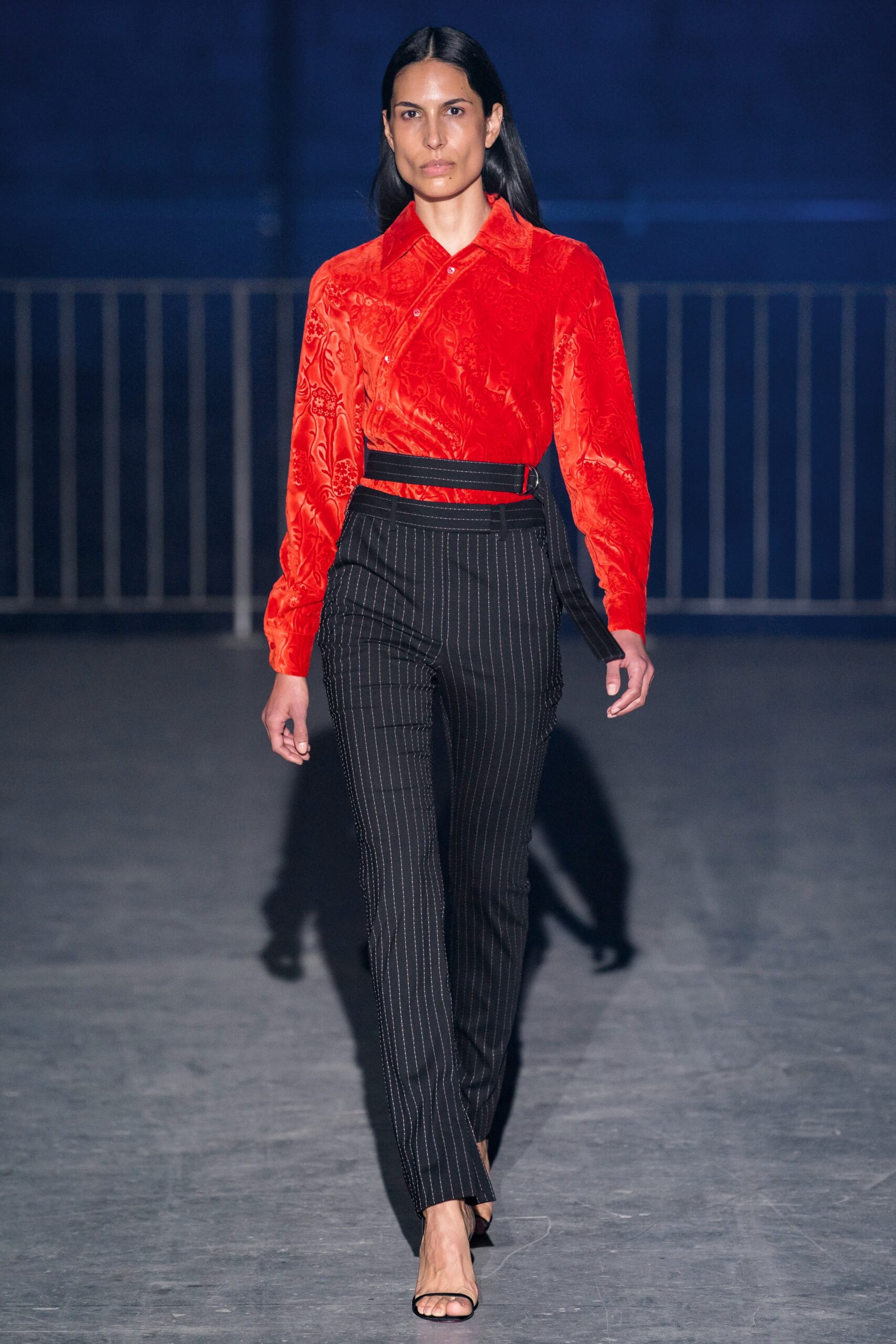 red silk fitted shirt with black tailored pants