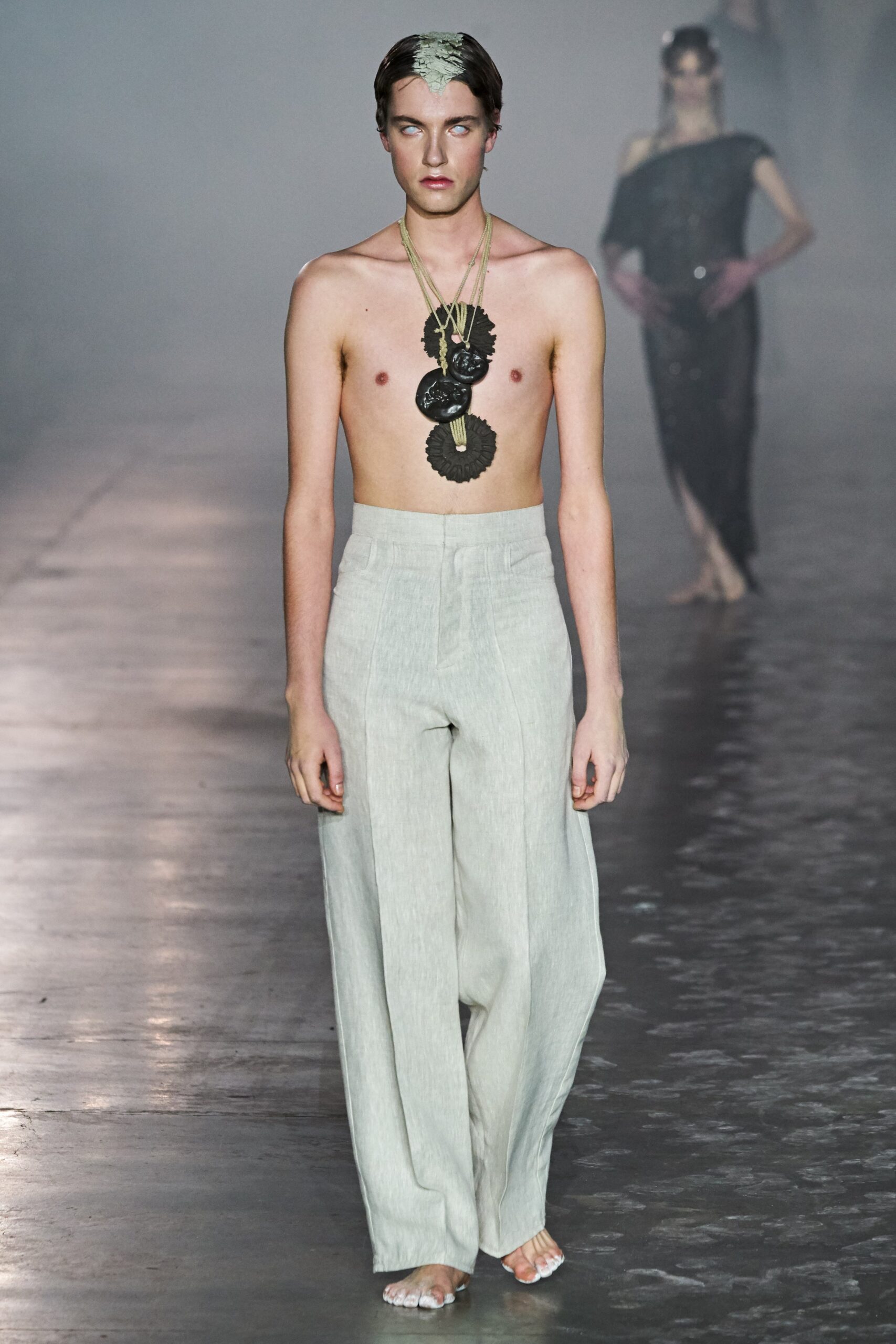 white relaxed linen pants and black top