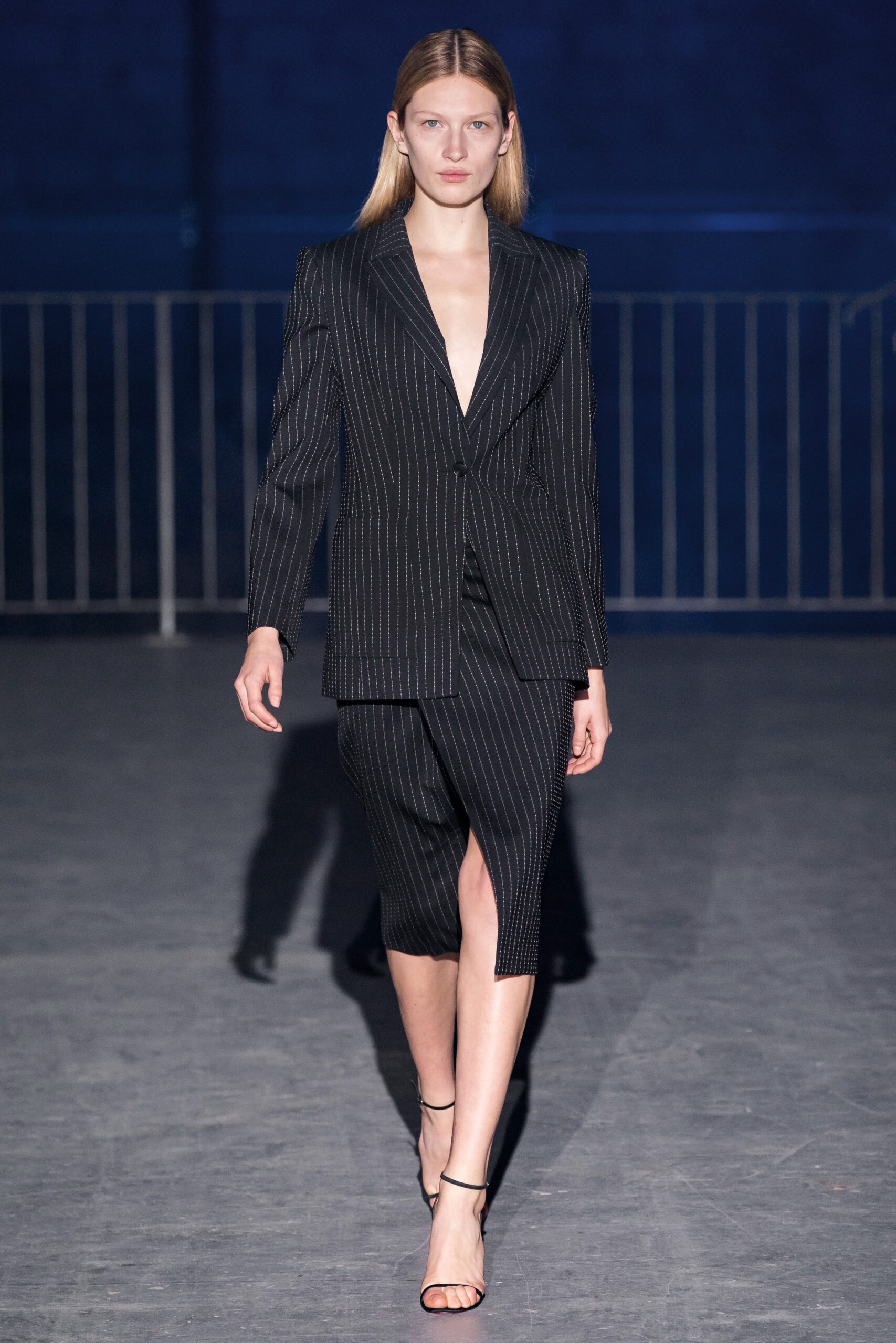 black fitted suit with slit