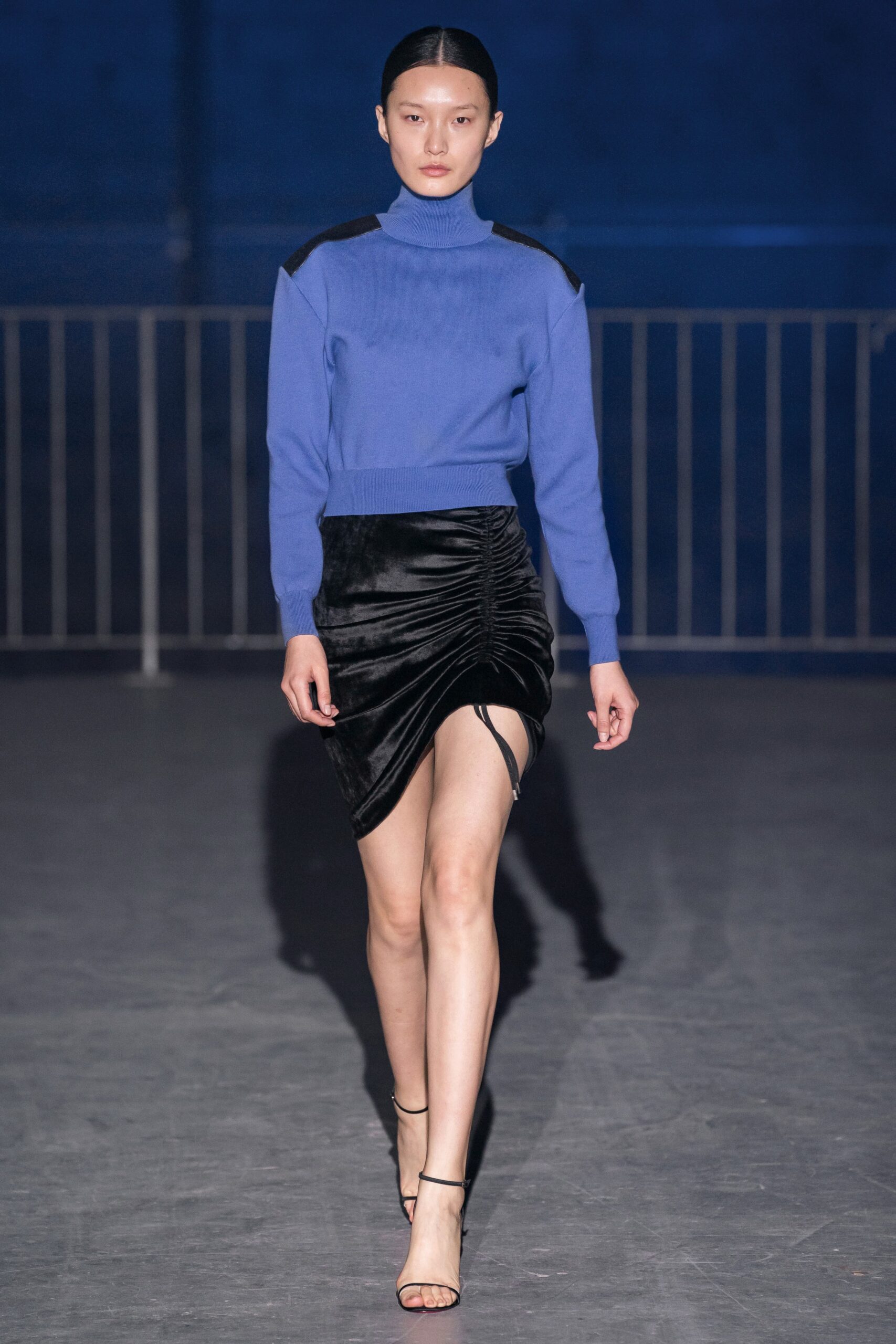 blue fitted sweater and black mini skirt