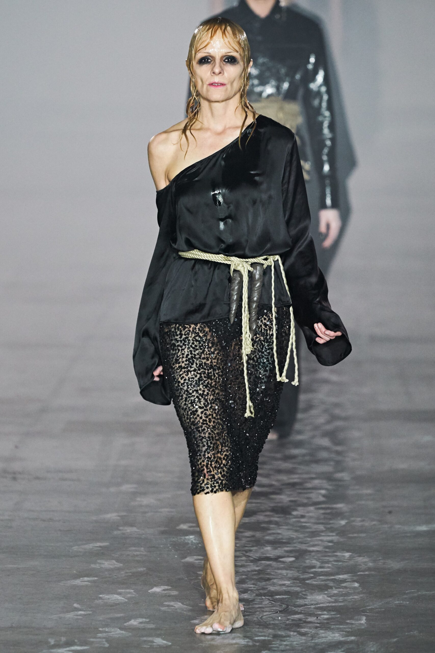black silk off-shoulder top and sequined skirt