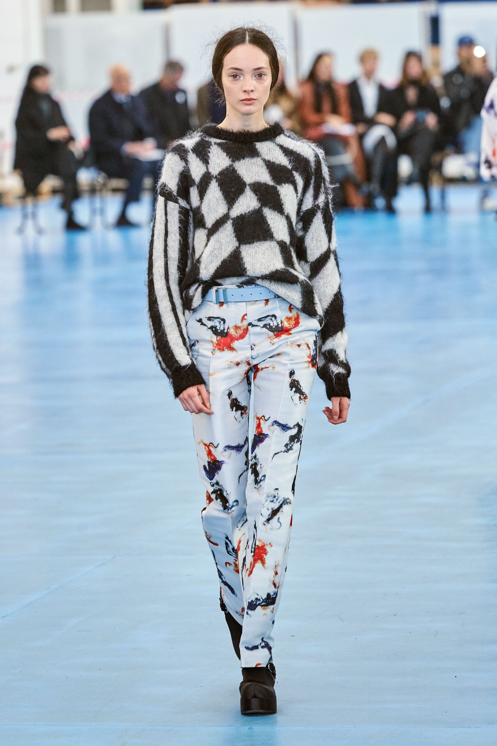 black and white checked sweater with printed pants