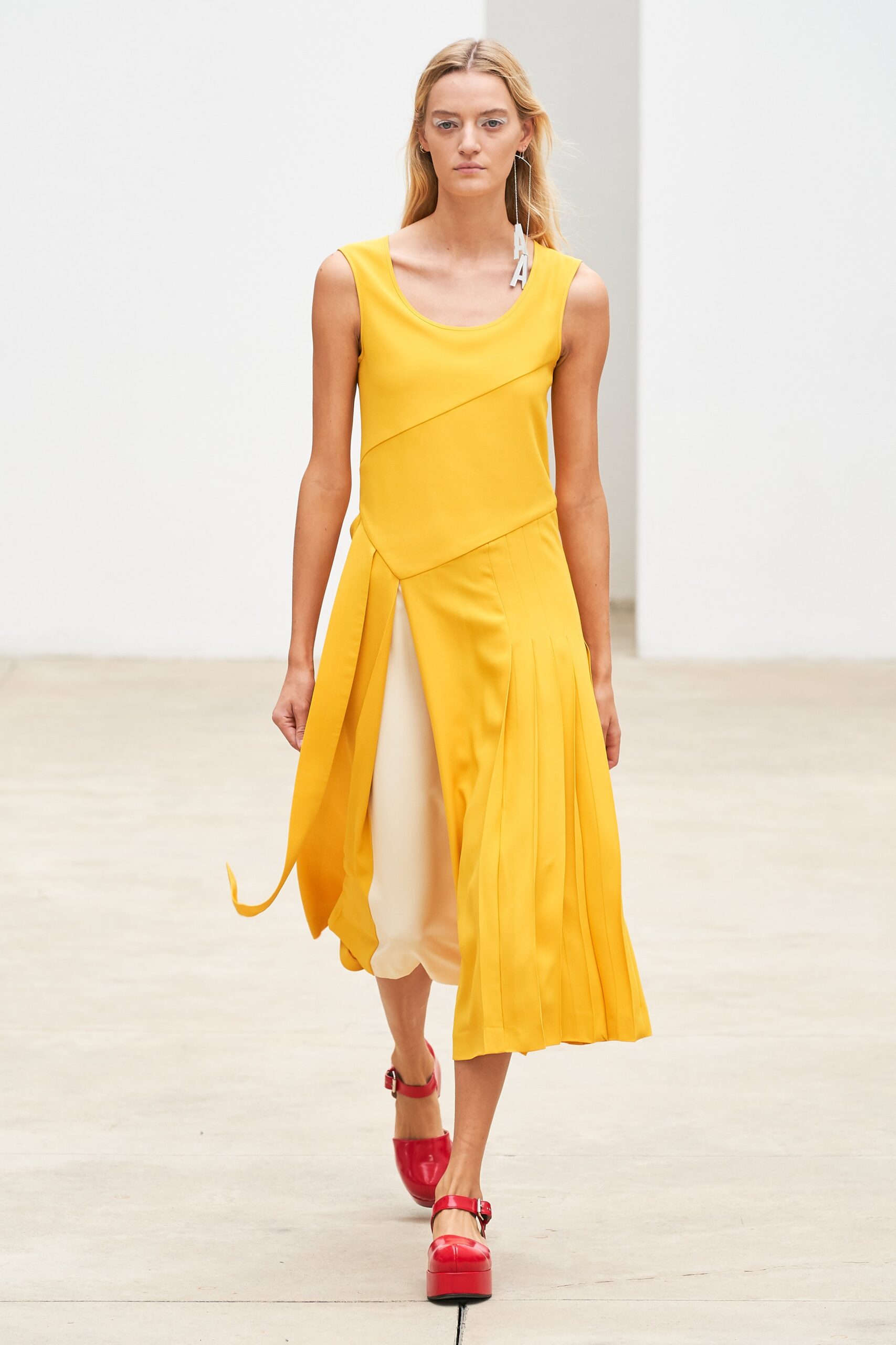 yellow pleated sleeveless dress