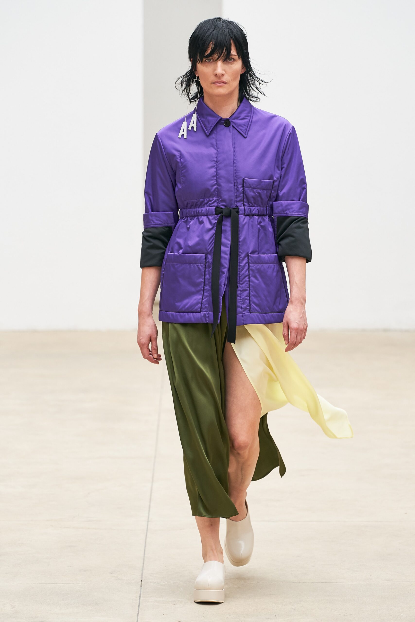 purple vinyl jacket and asymmetric dress