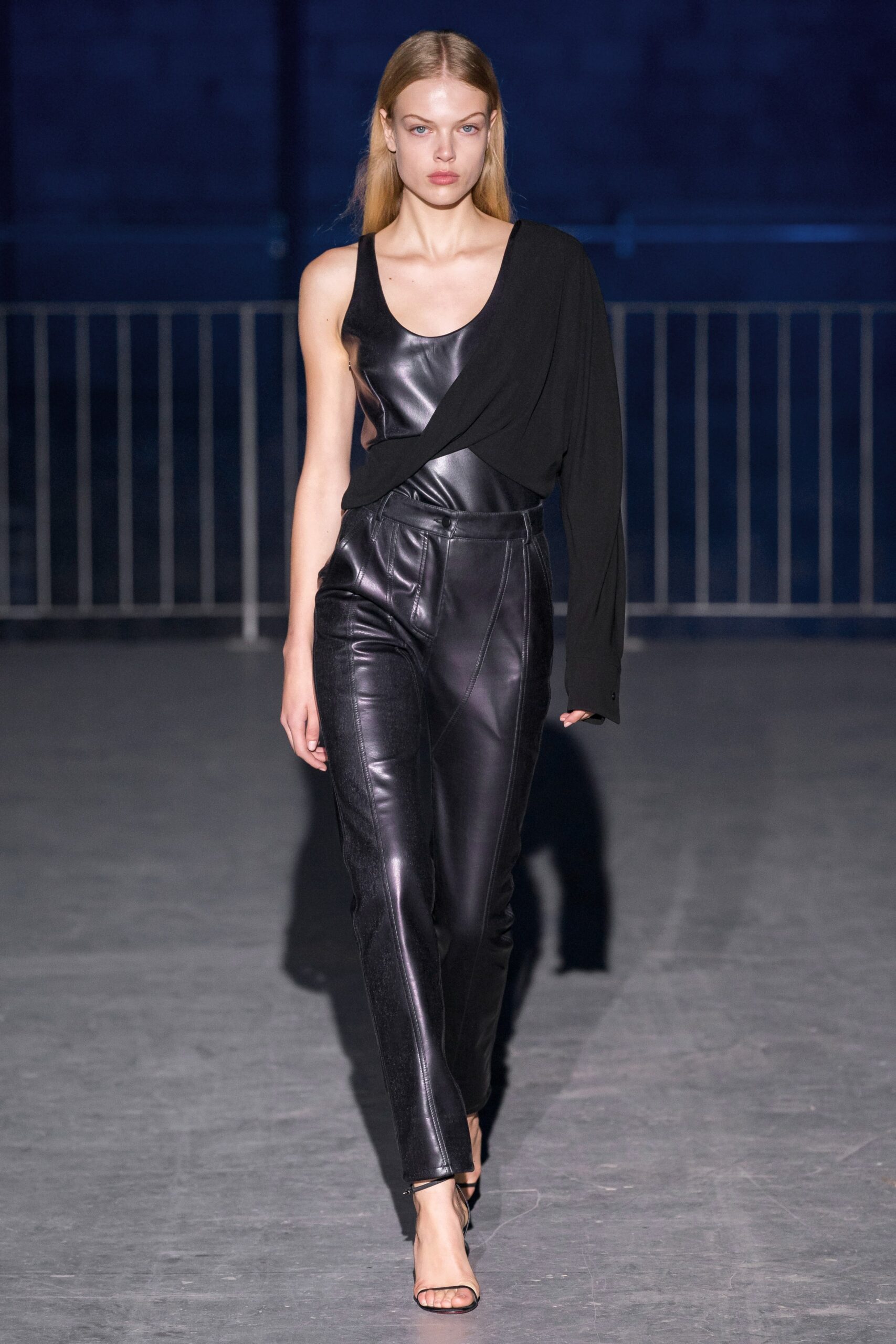 black leather asymmetric top and fitted pants
