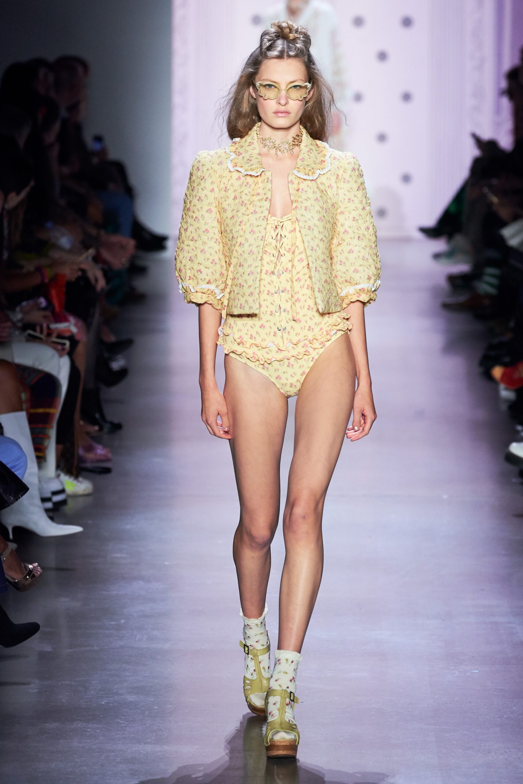 yellow floral blouse and beige swimsuit