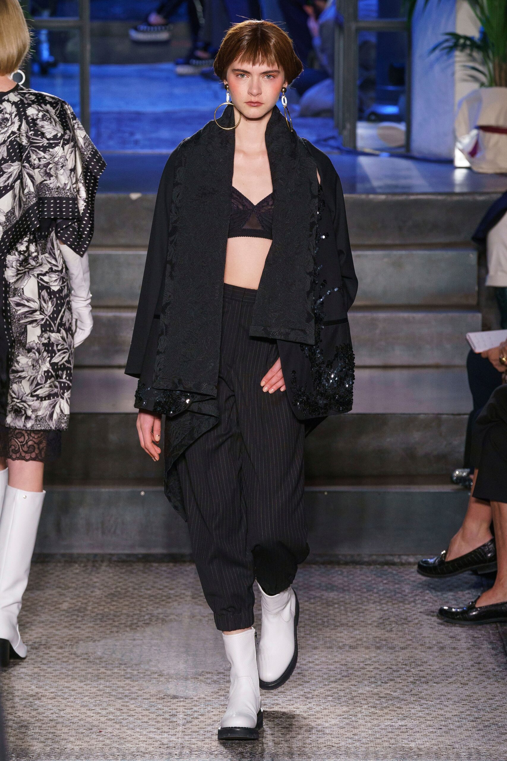 black silk sleeveless top with relaxed pants