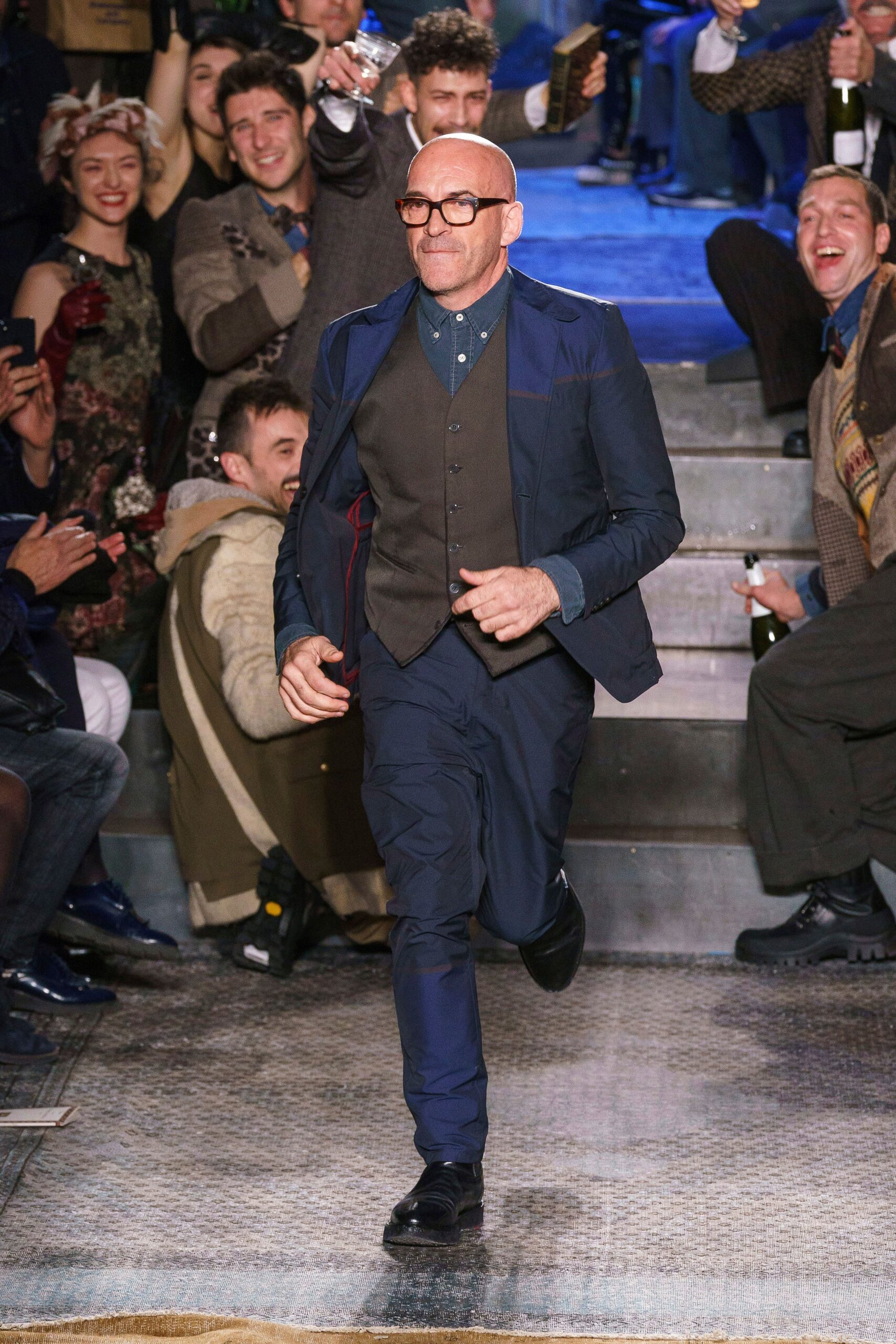 blue tailored suit with gray vest