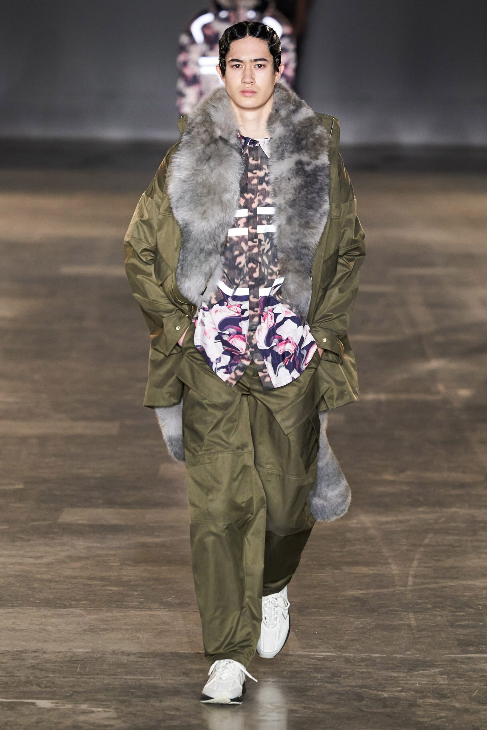 green coat with floral shirt