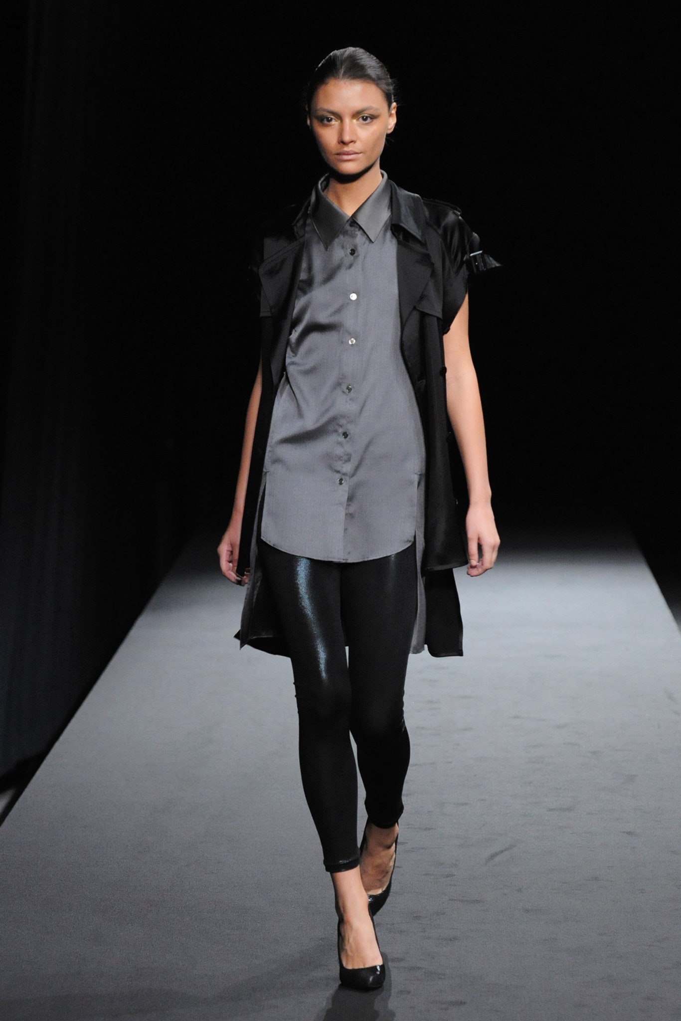 gray shirt with black vest
