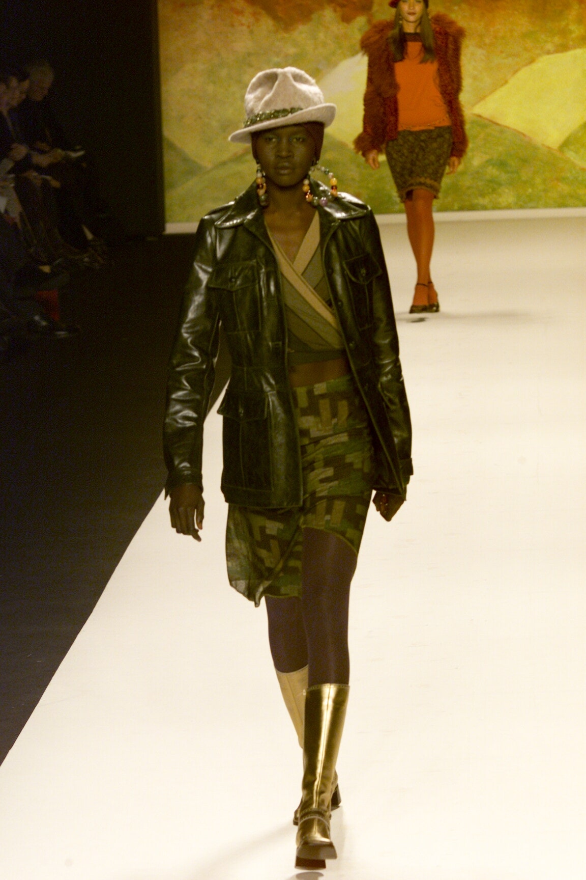 black leather fitted jacket with camouflage skirt