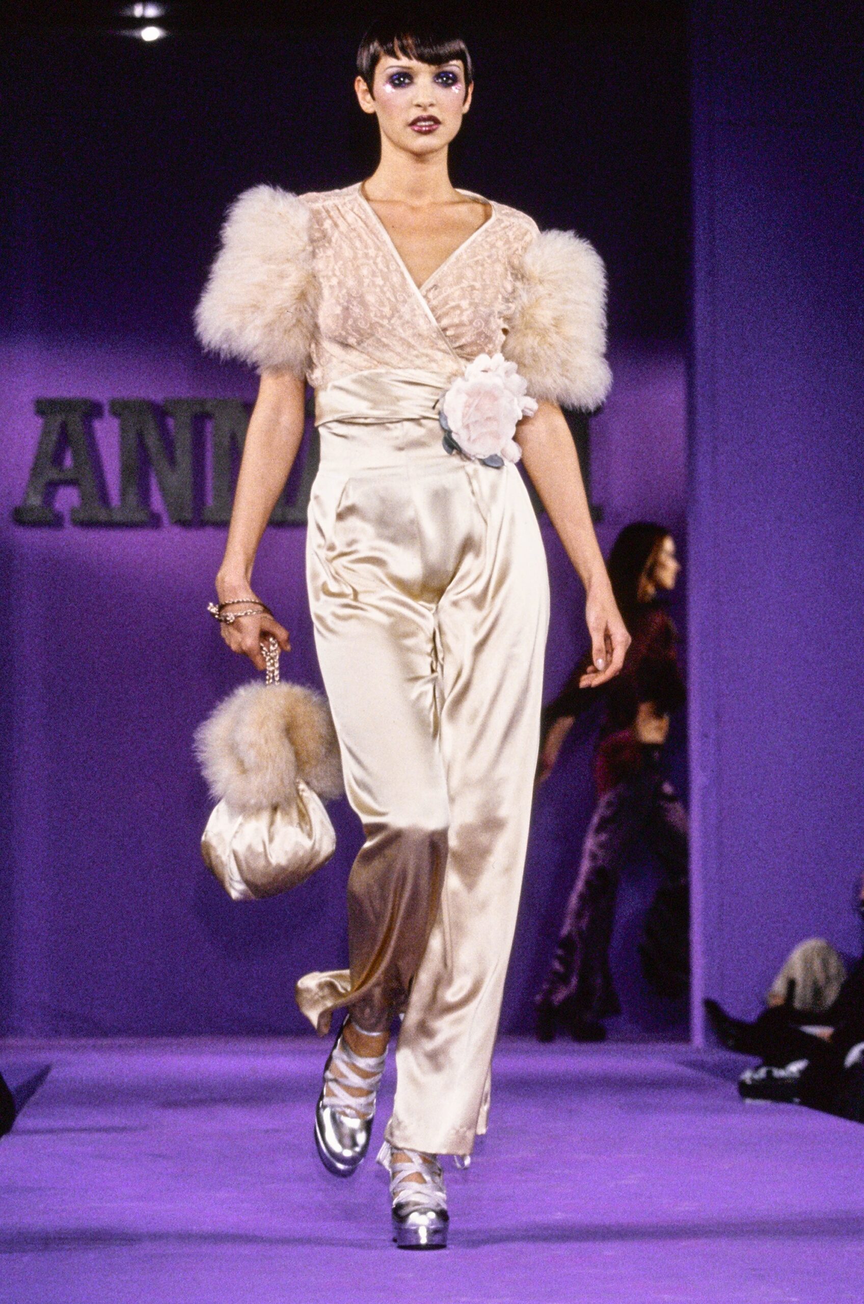 beige silk fitted top and cream pants