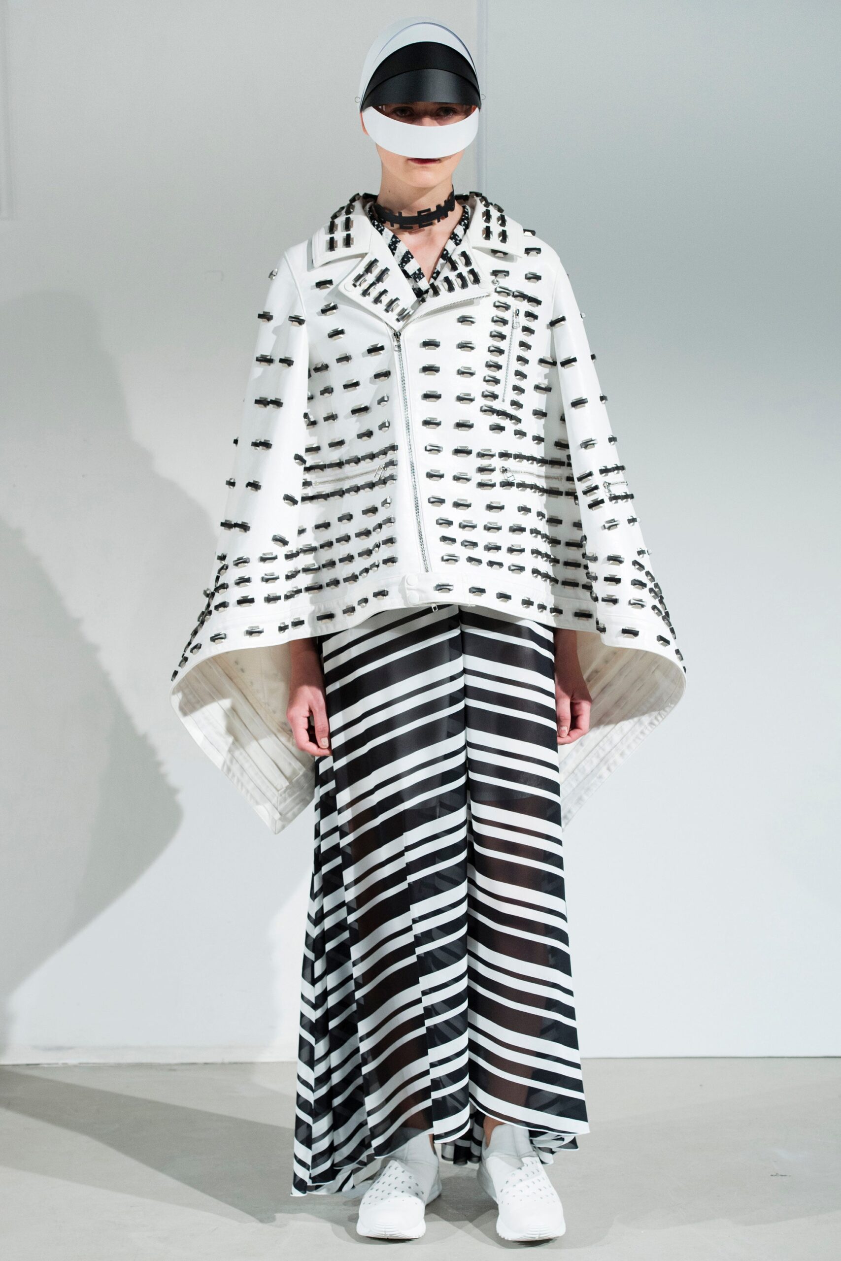 white embroidered cape with striped maxi skirt