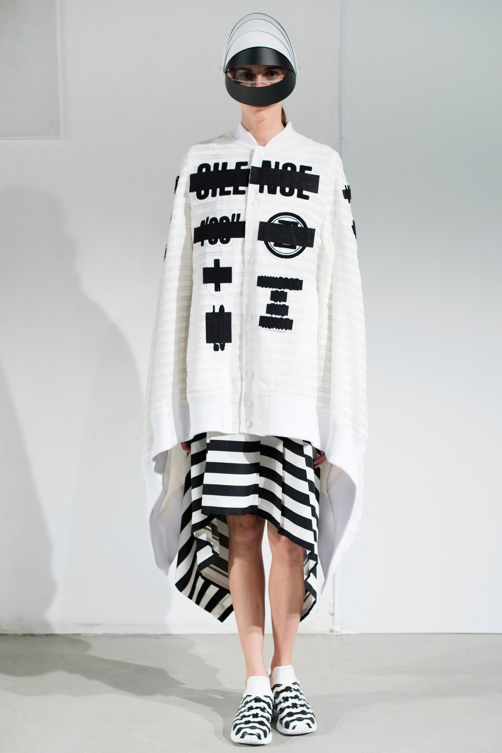 oversized white cape with striped skirt