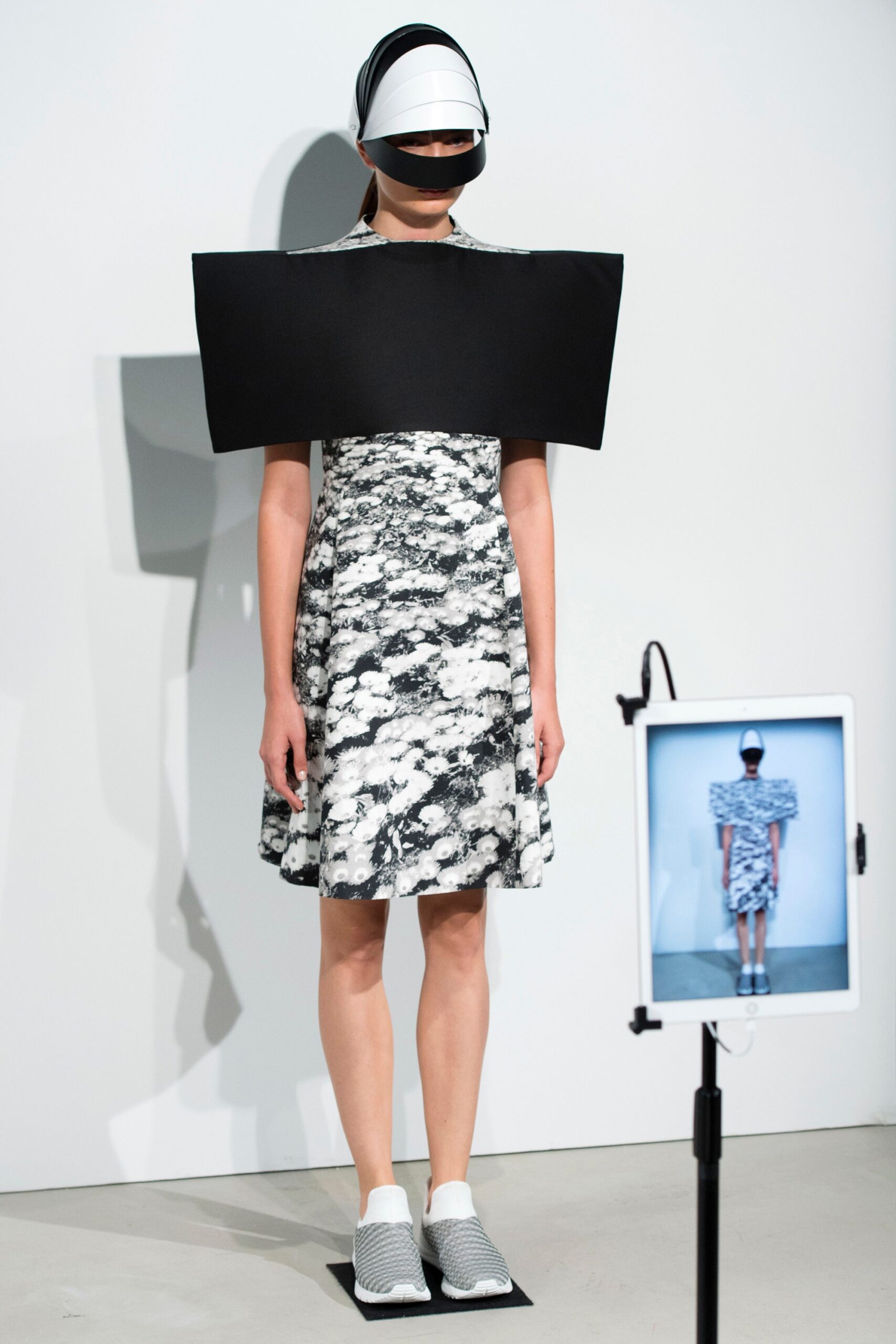 black and white flared mini dress with structured hat