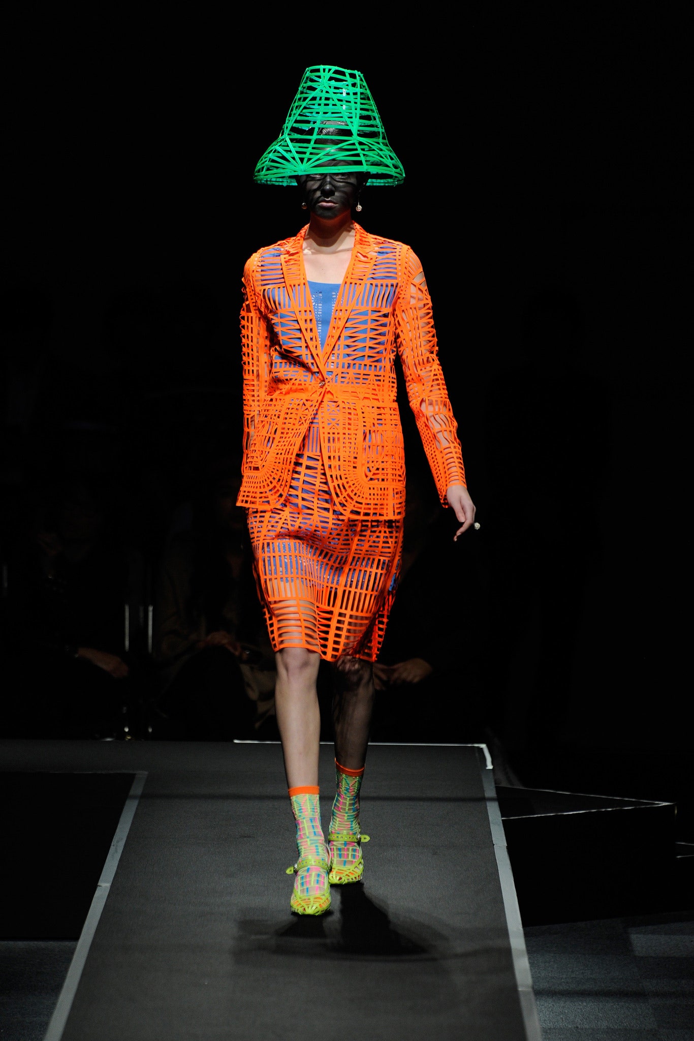 fitted orange vinyl blazer and skirt