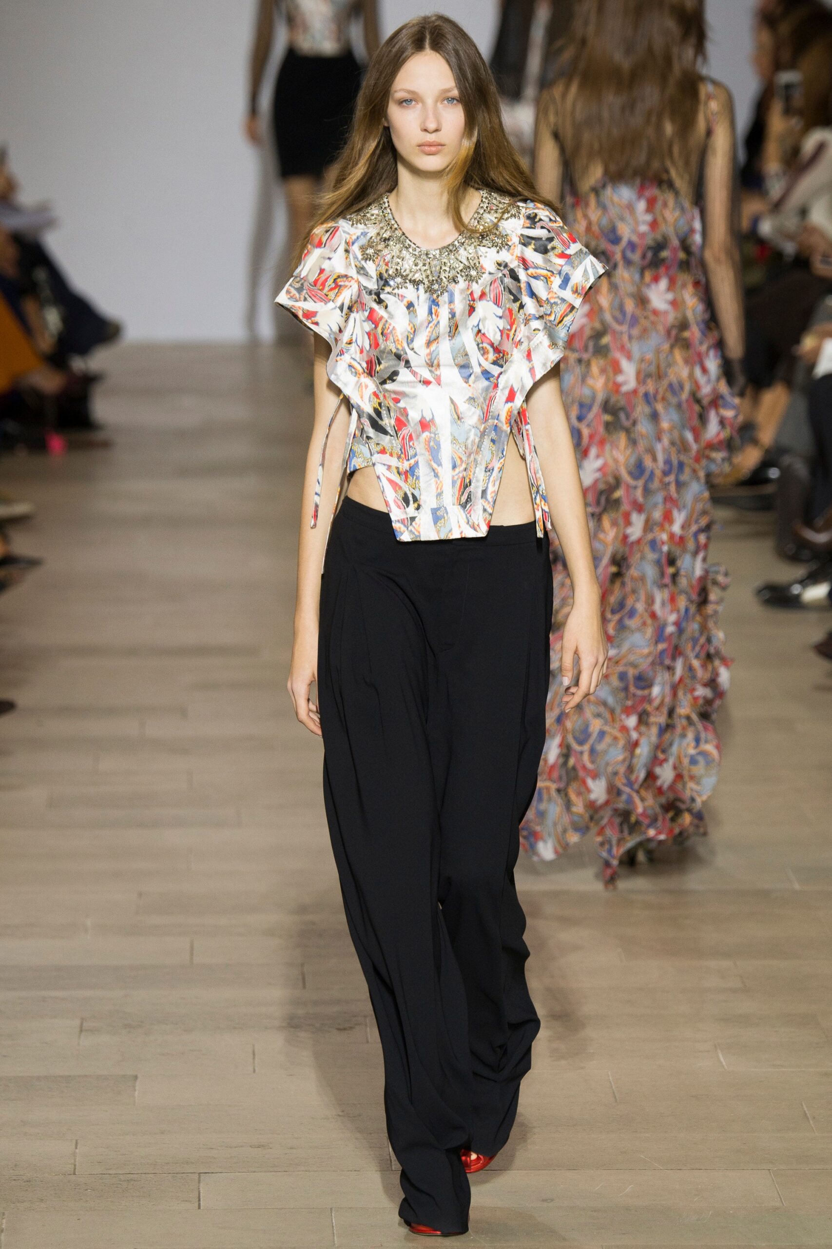 fitted multi-colored top with relaxed black pants