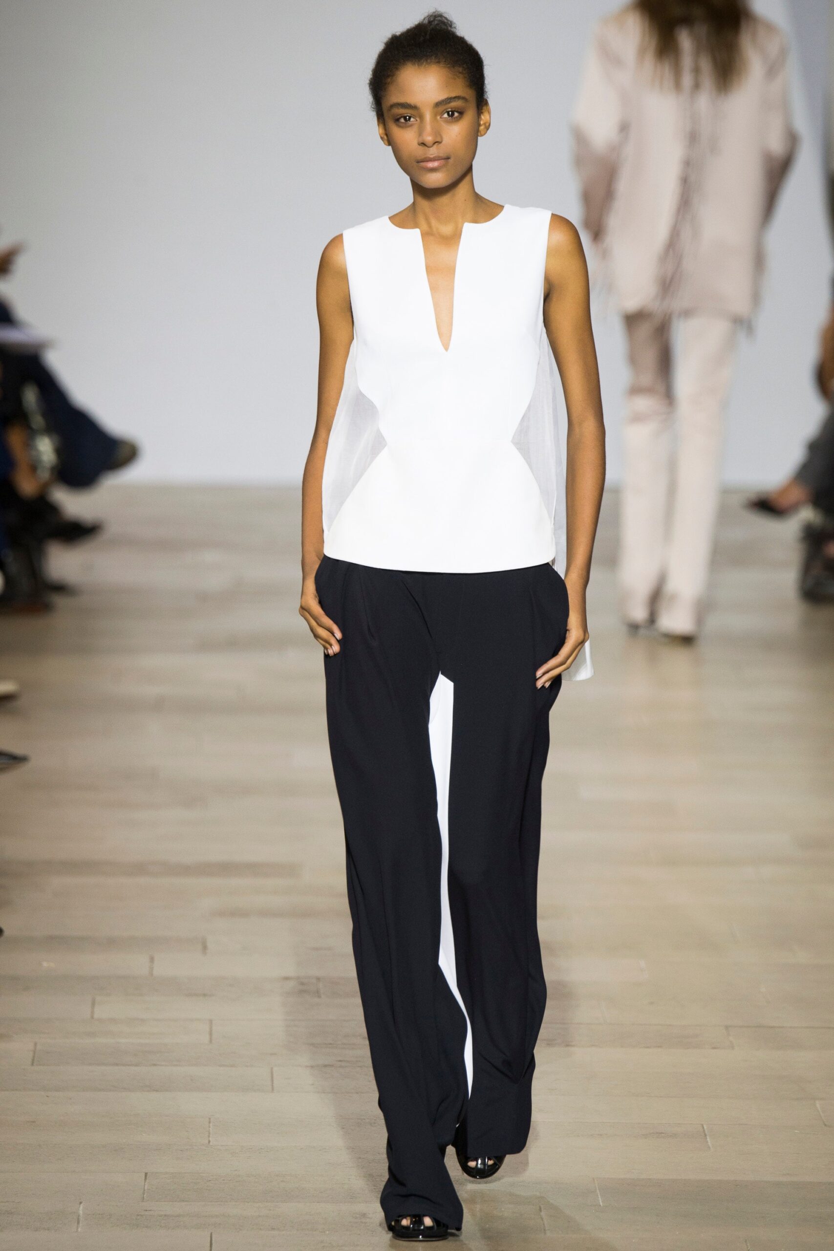 white fitted top and black pants
