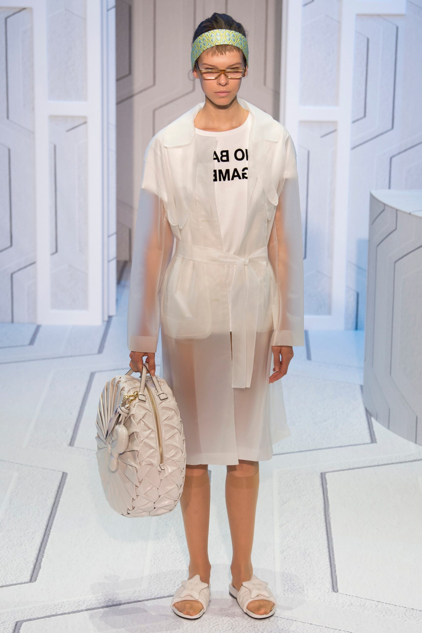 white vinyl coat with black t-shirt