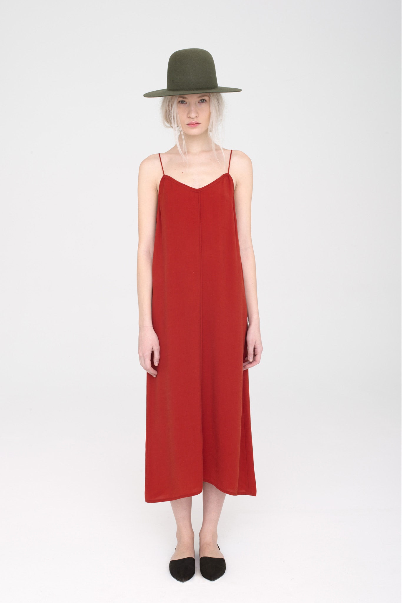 red silk midi dress with green hat