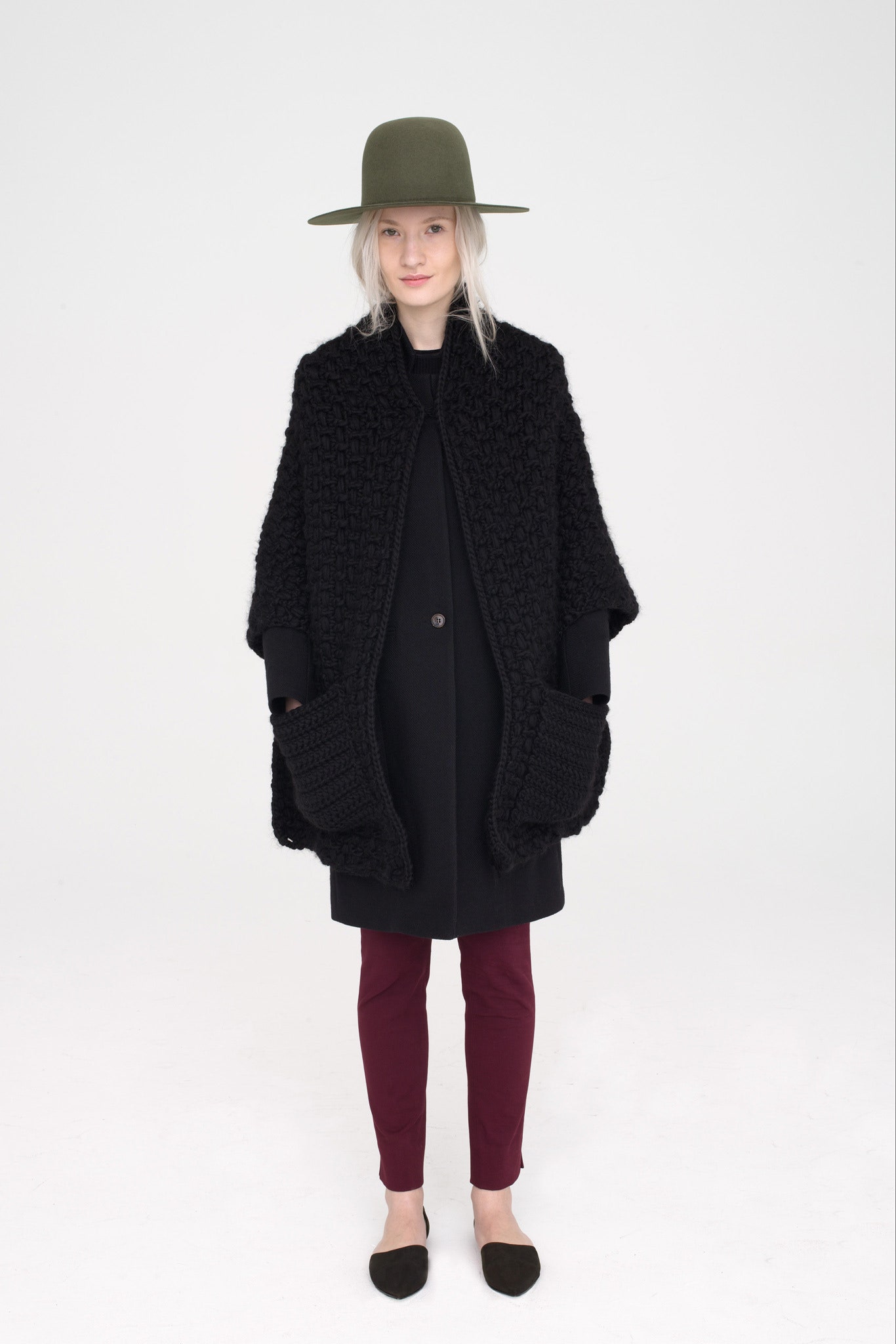 black wool coat with maroon pants