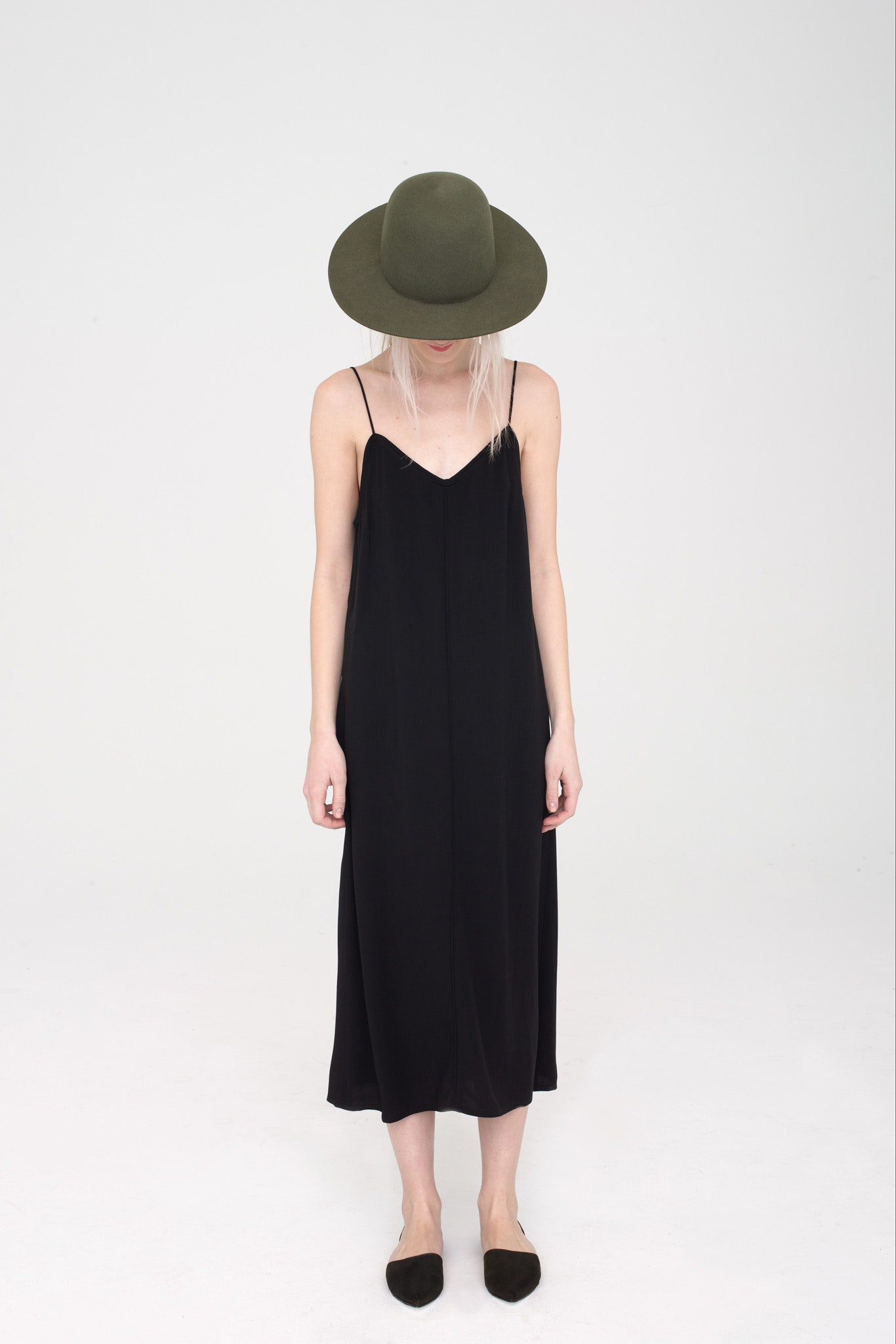 black silk midi dress with green hat