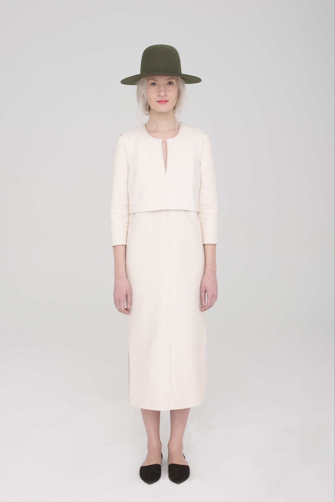 white fitted midi dress with green hat