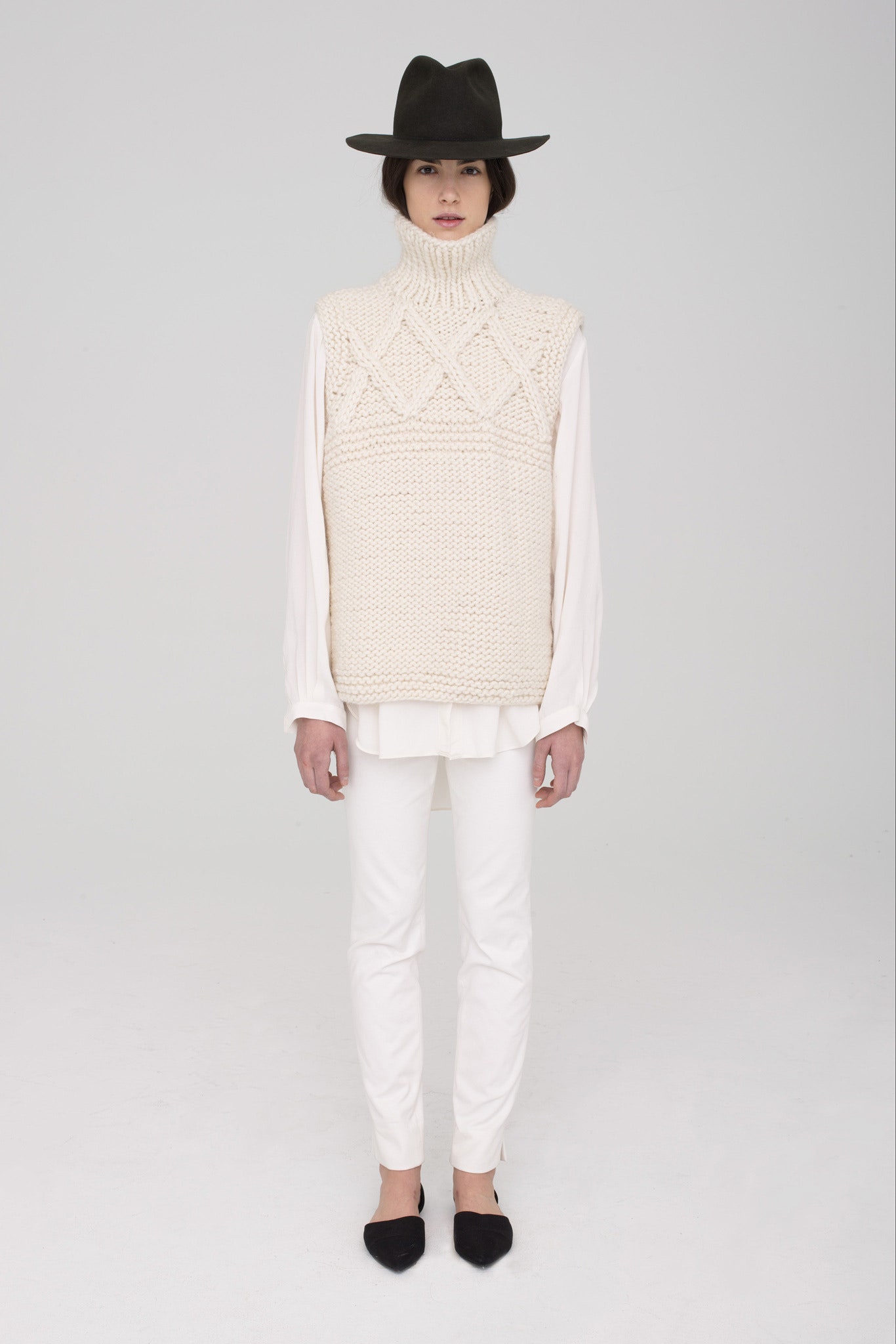 white knitted sweater with black hat
