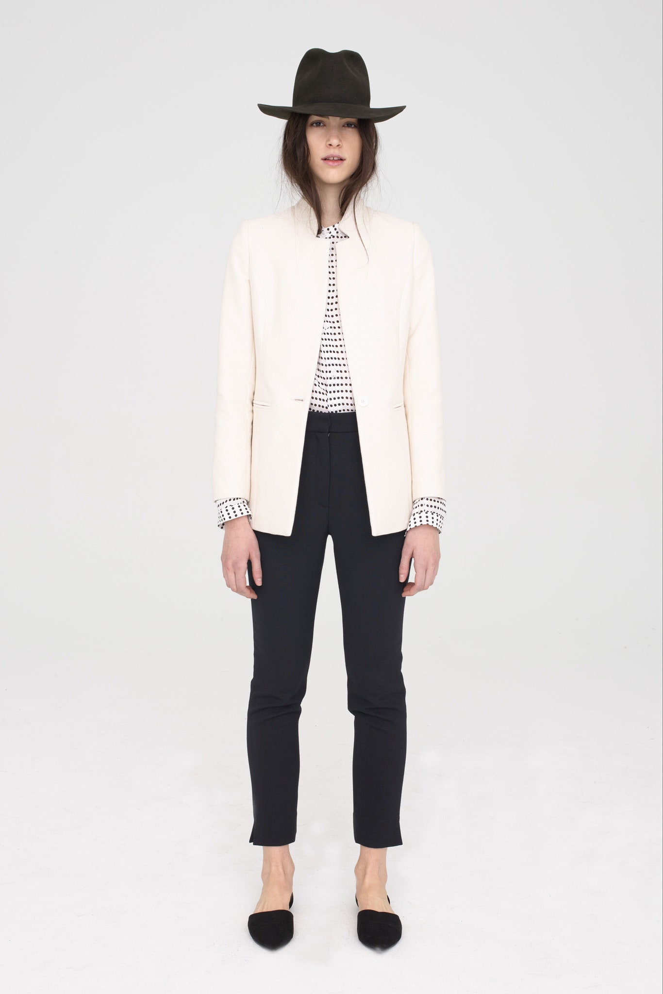 white tailored blazer with black pants