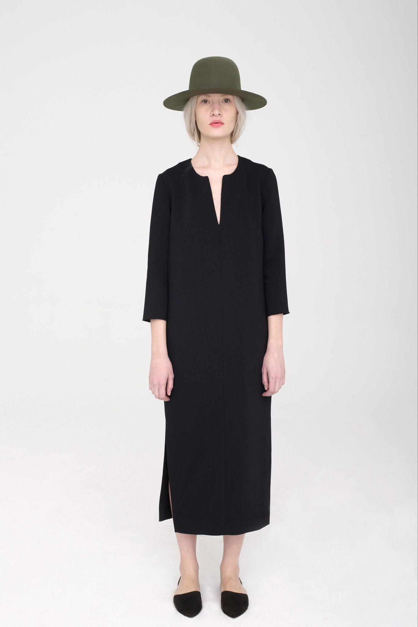black midi dress with green hat