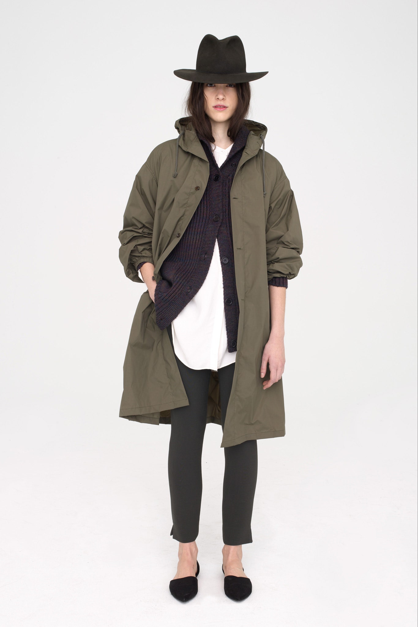 green relaxed coat with white blouse
