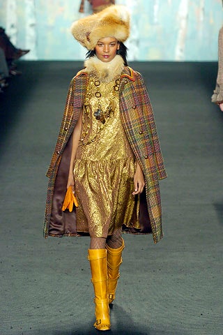 multi-colored cape and gold dress