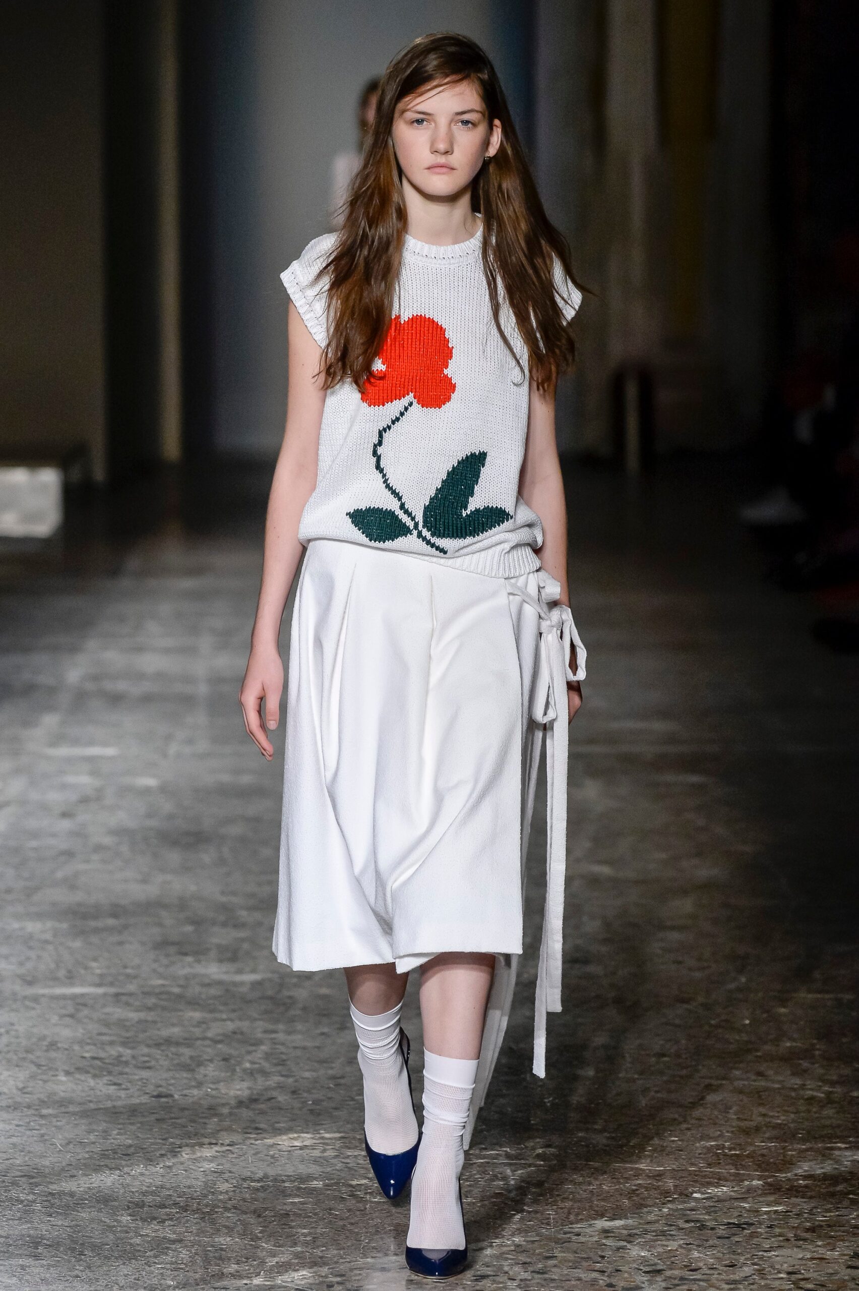 white embroidered top with pleated skirt