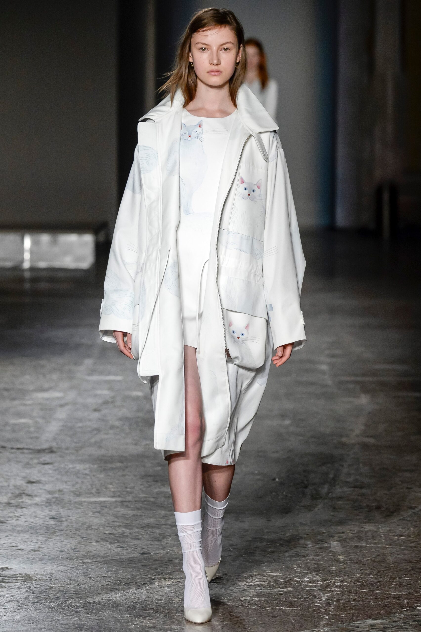 white relaxed coat with mini dress