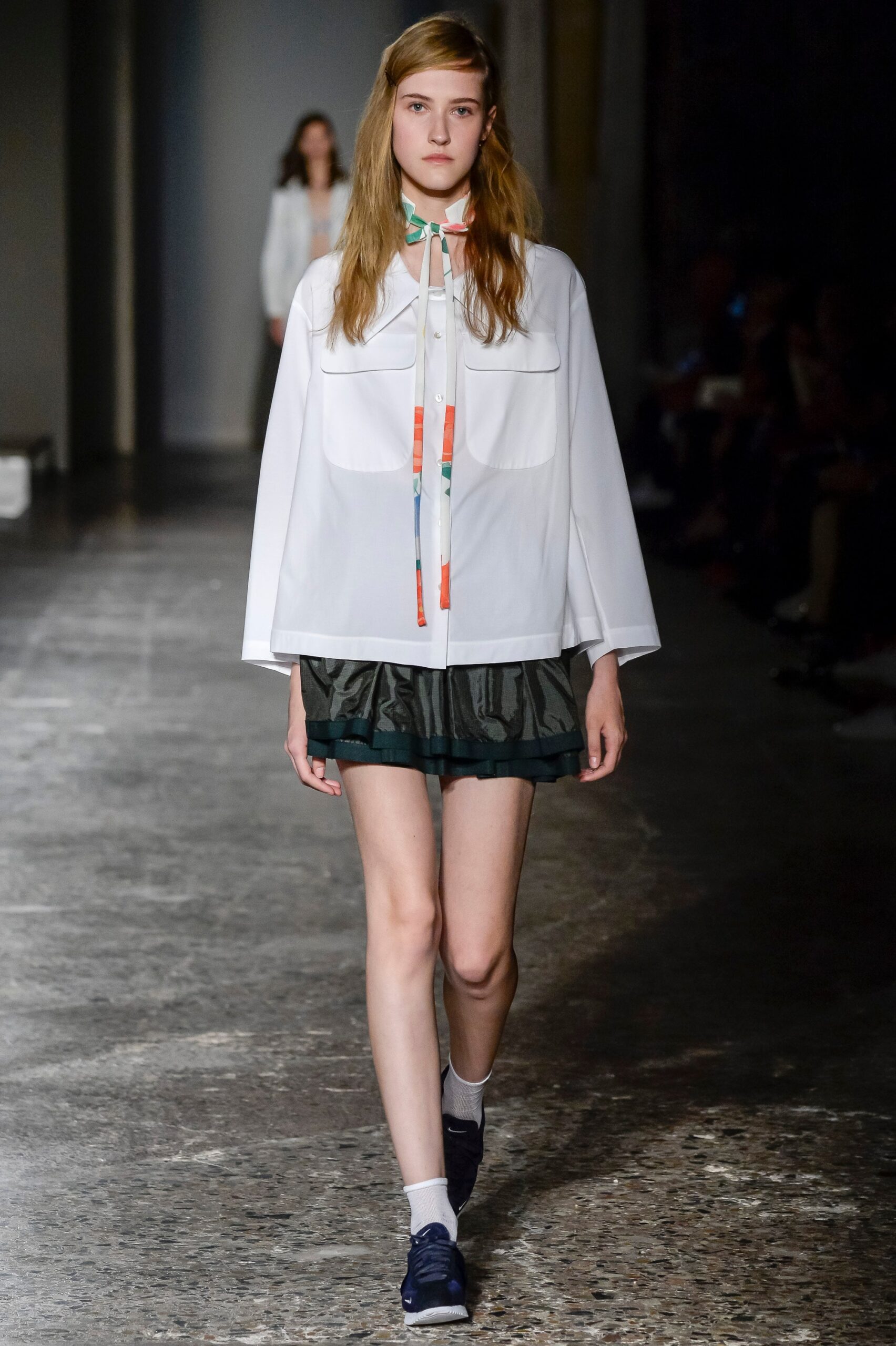 white relaxed blouse with camouflage skirt