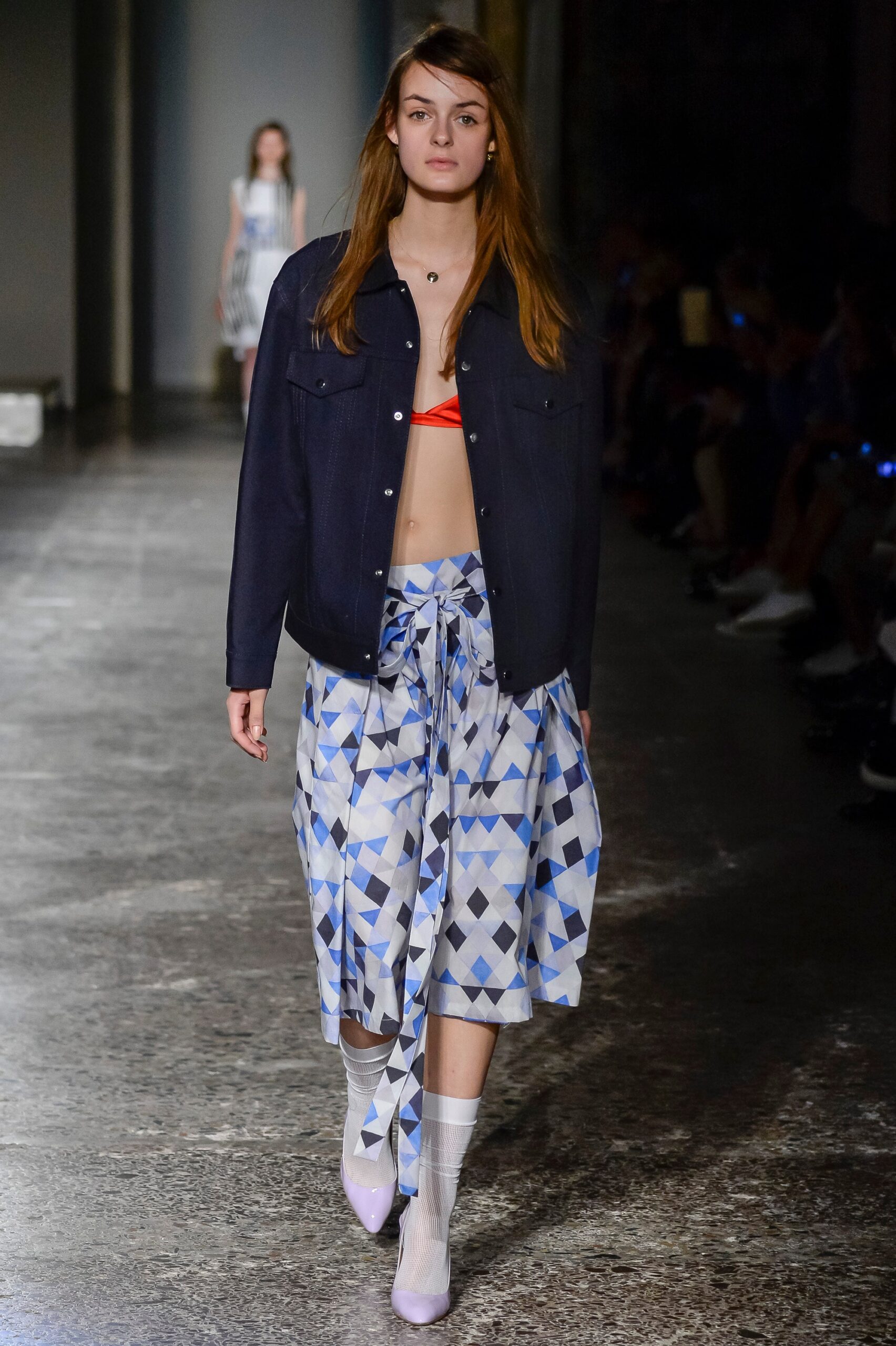 blue denim jacket with red top