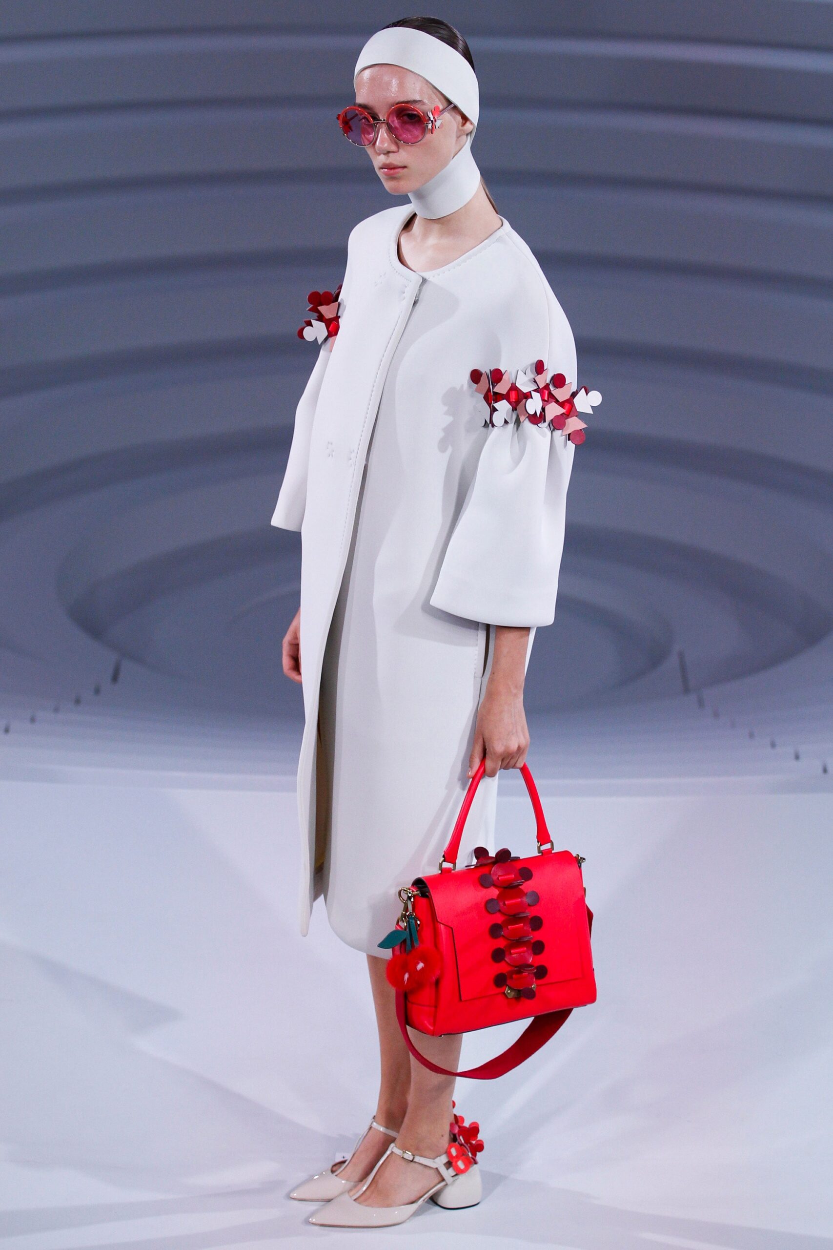 white relaxed coat with red bag