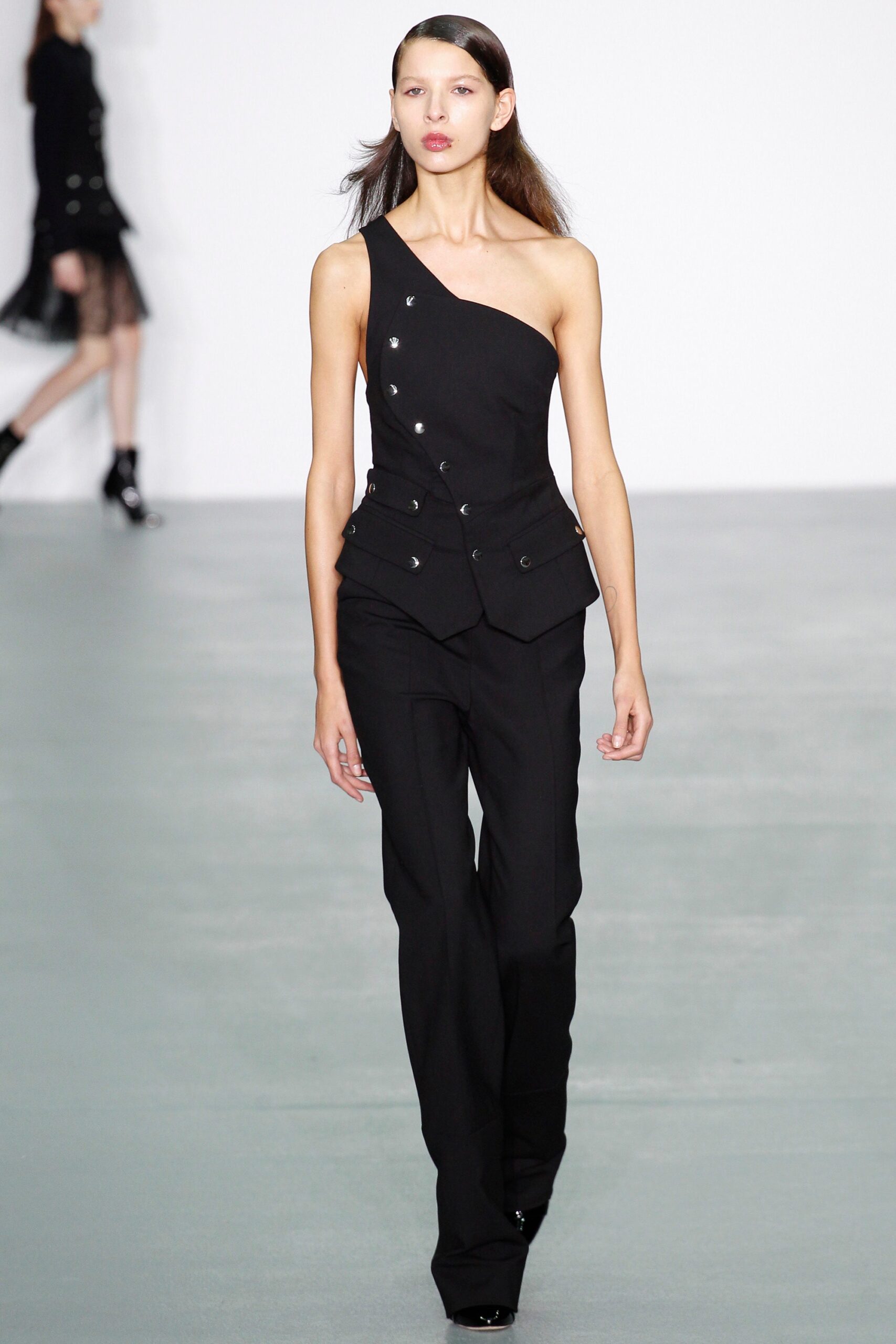 black sleeveless asymmetric fitted buttoned top