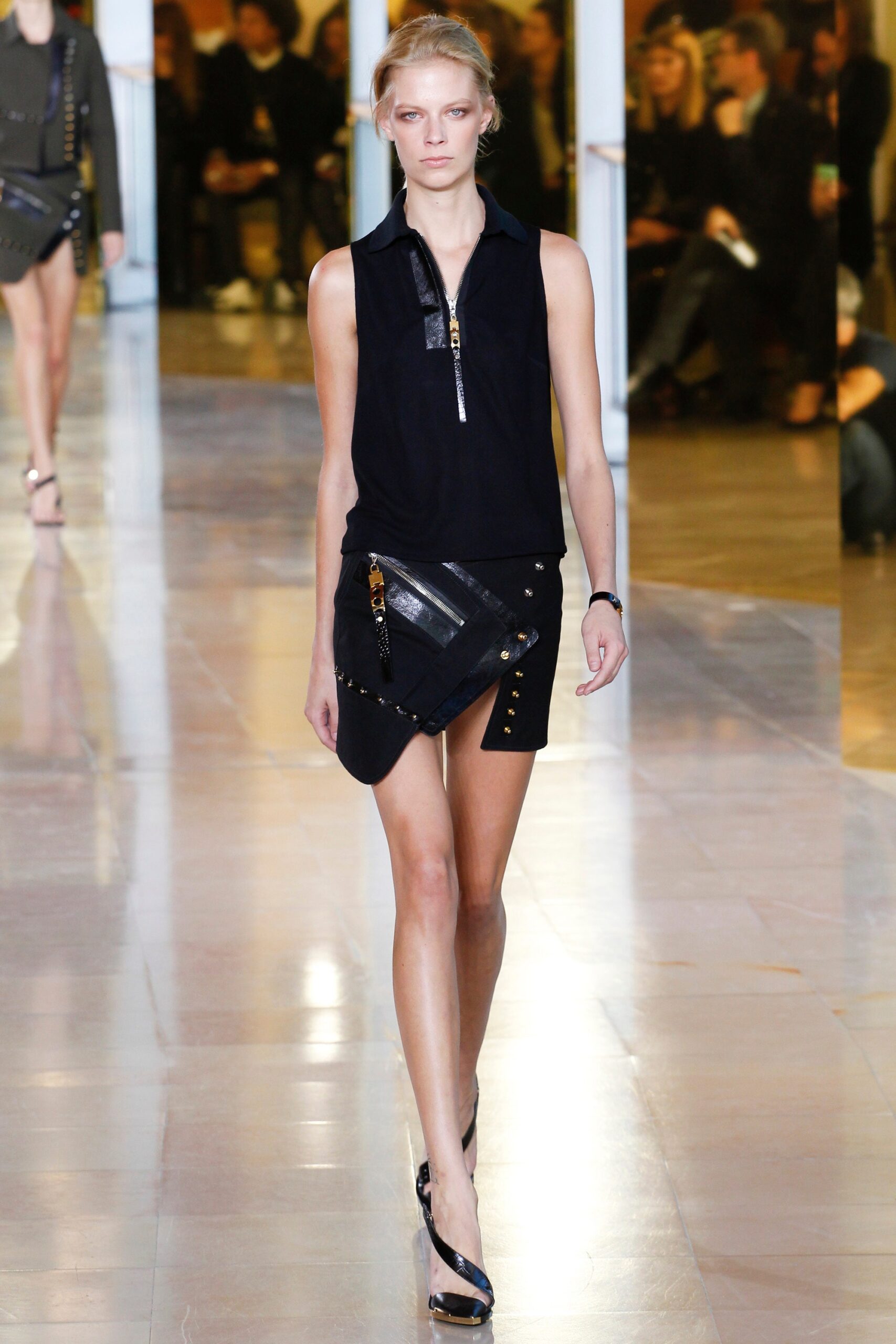 black fitted top and mini skirt