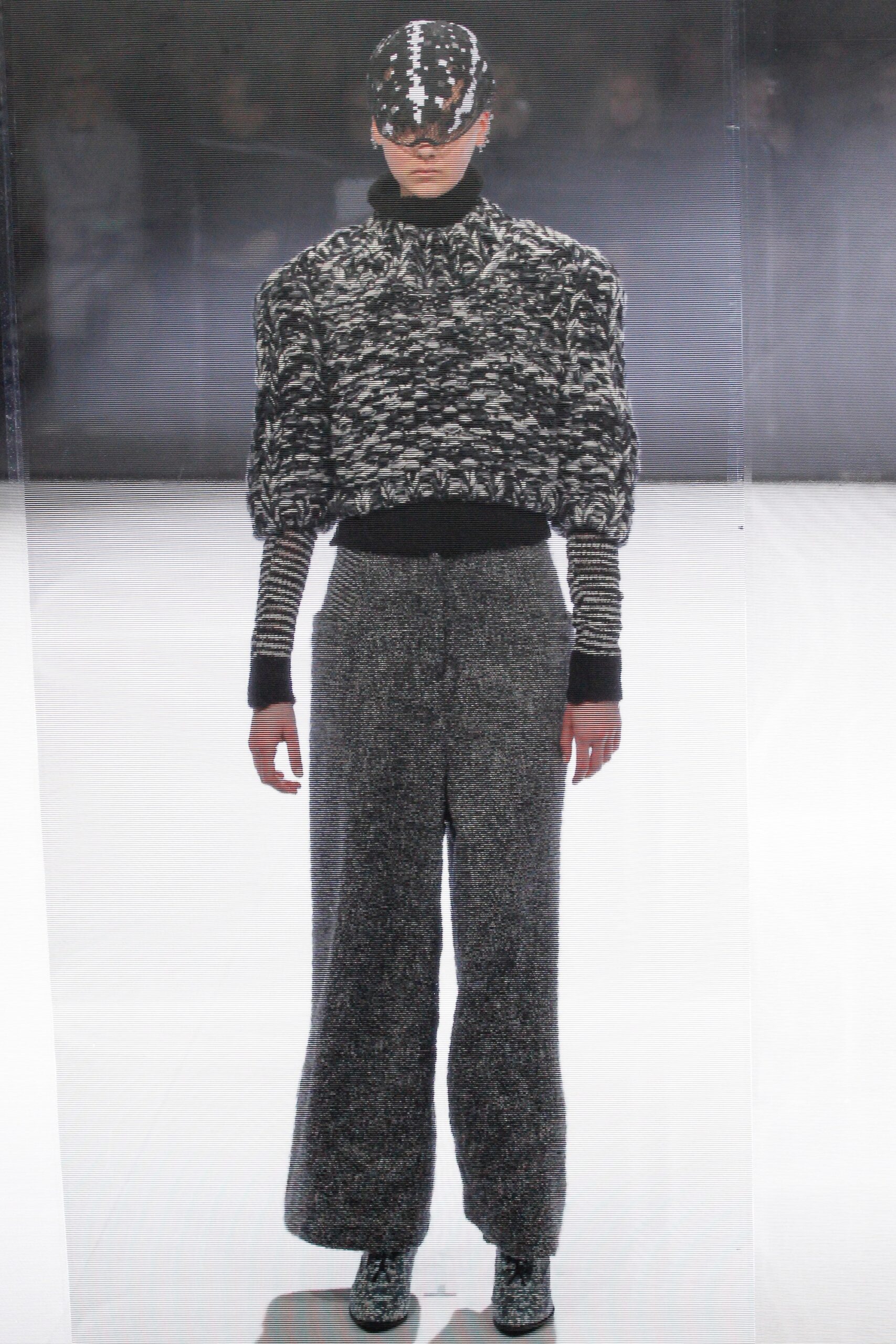 relaxed black and white wool top with gray pants